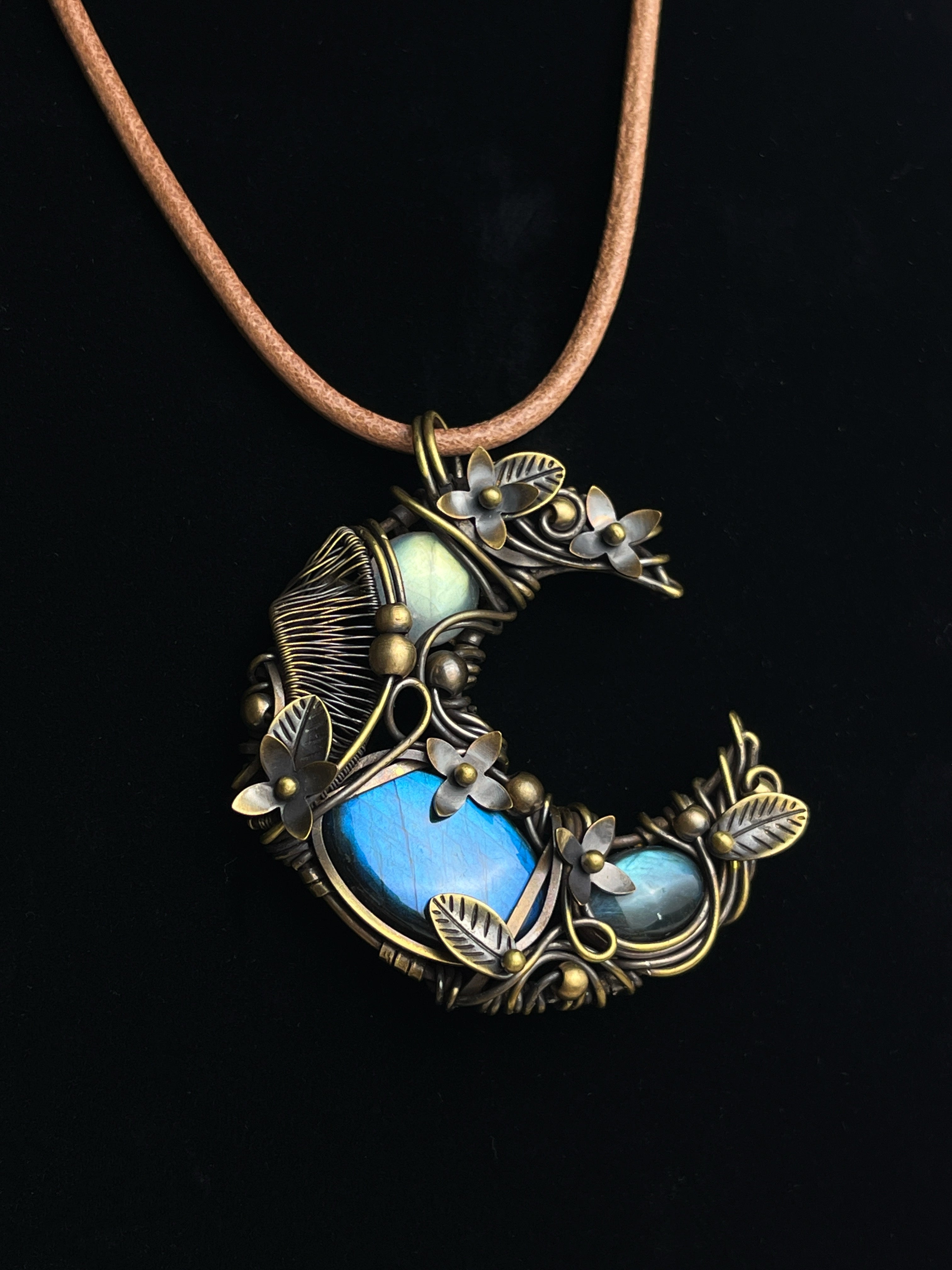 Floral crescent labradorite pendant wrapped in antiqued brass wire