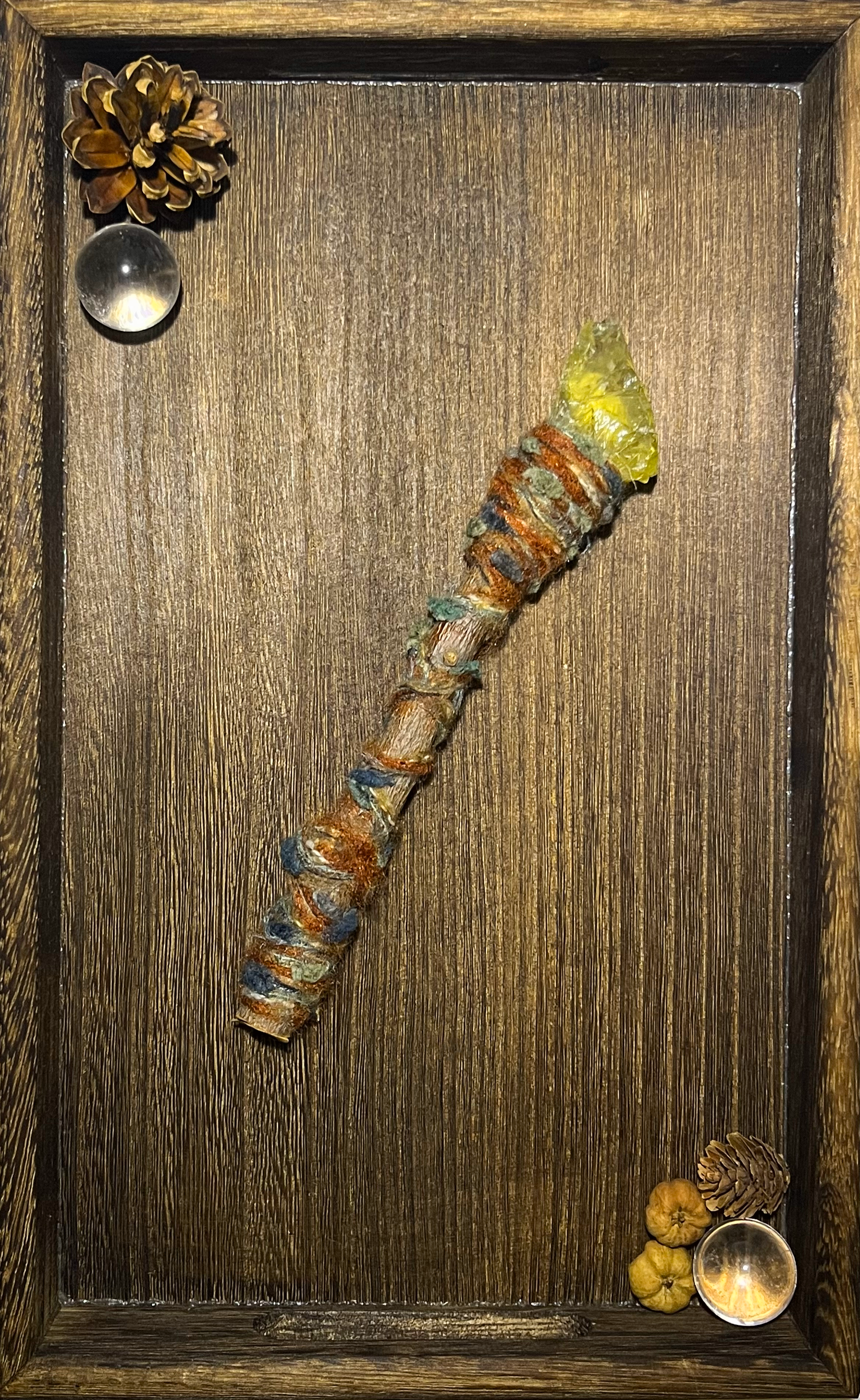 Flat lay of raw citrine wand on ceramic plate with warm sunlight