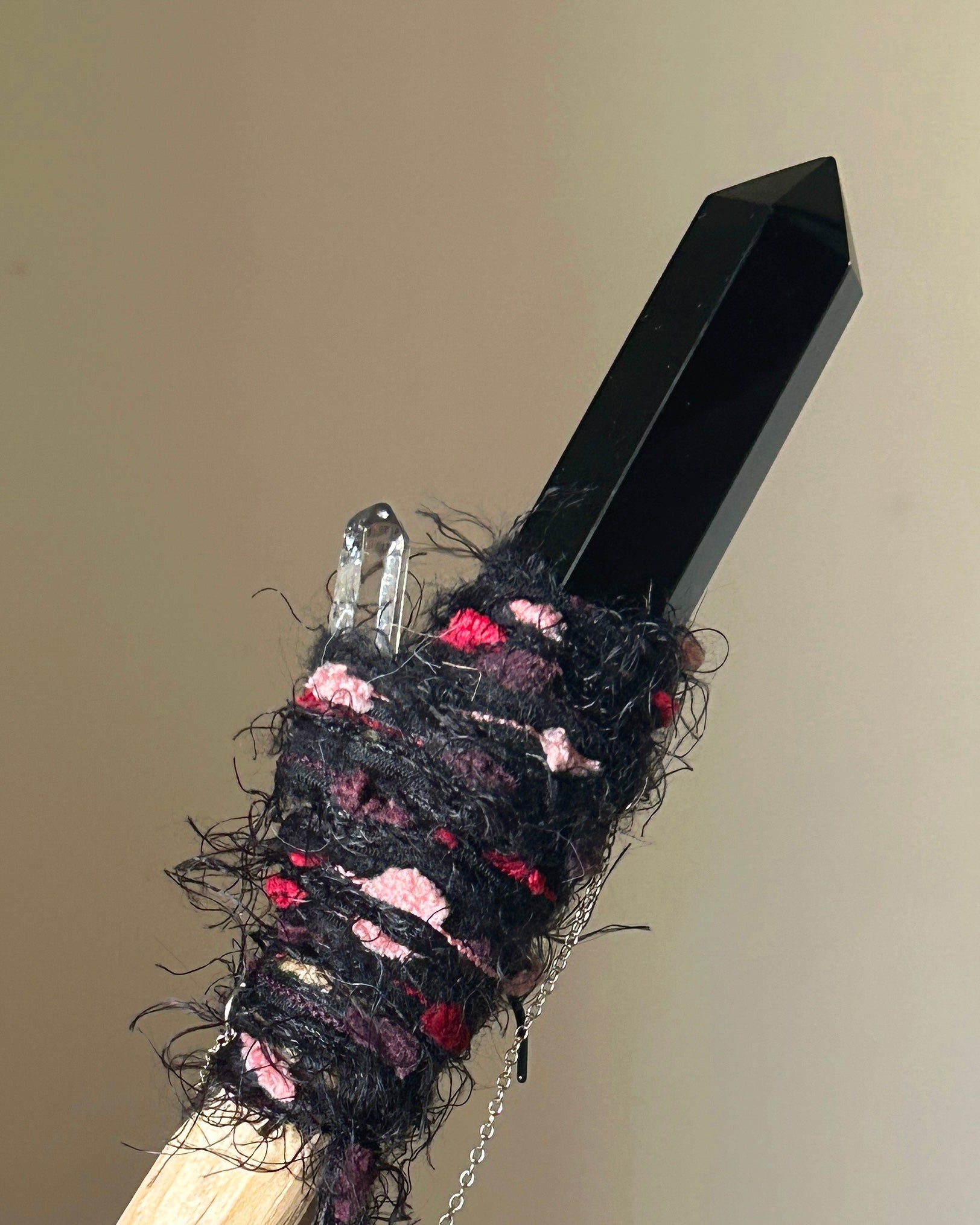 Rear view showing birch handle and silver chain detail