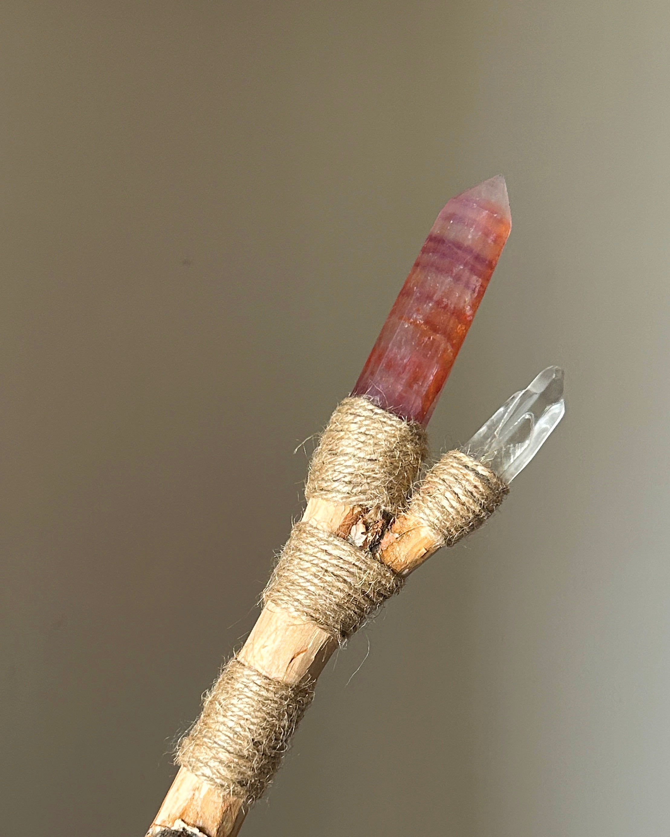 Back view of fire element wand with branching quartz and jute wrap