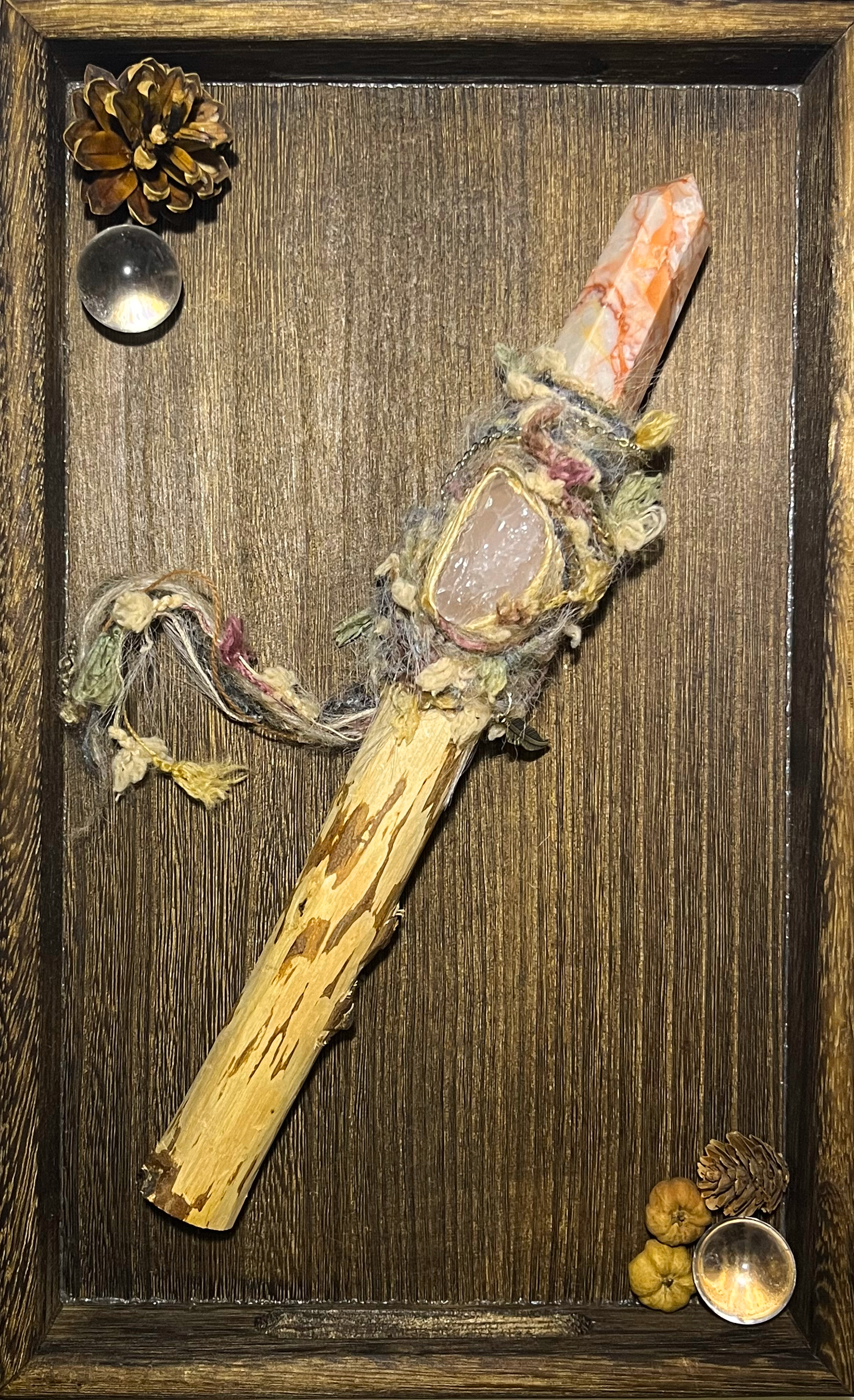 Flat lay of pink-toned birch wand for emotional healing and self-love magic