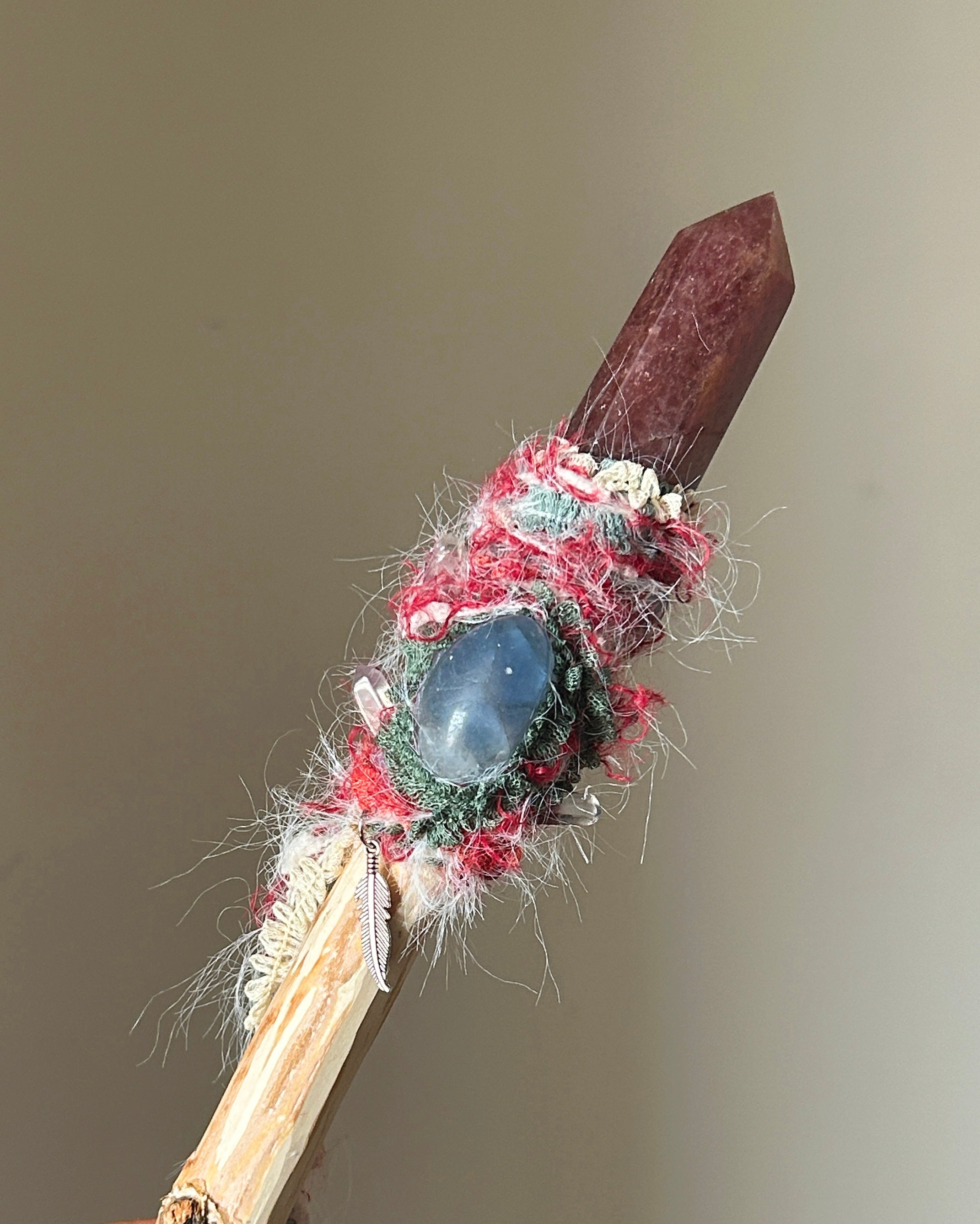 Front view of birch wand with strawberry quartz and blue kyanite