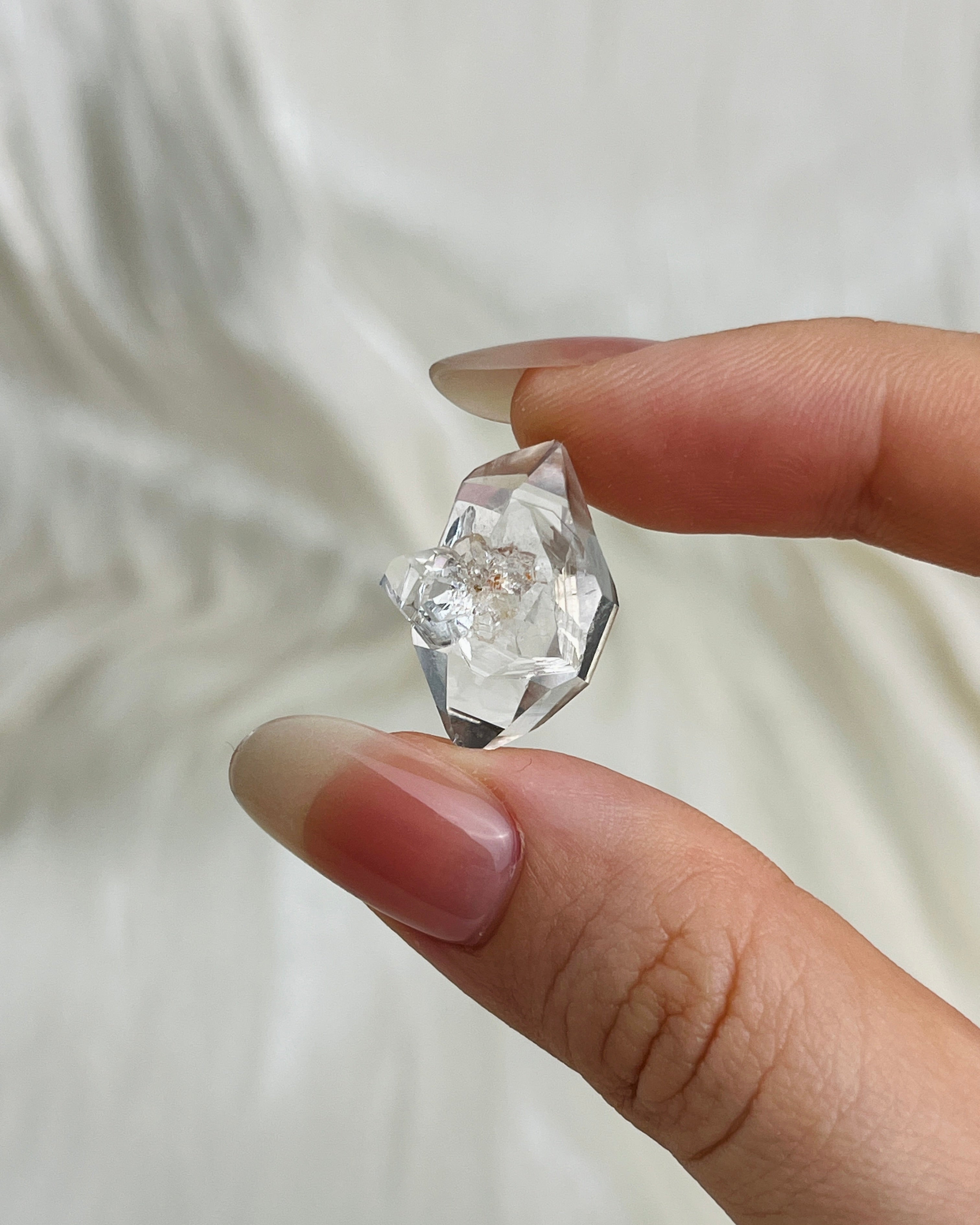 Bright Chongqing Diamond Quartz crystal with a flower-shaped surface mark and a light grey tip from China4