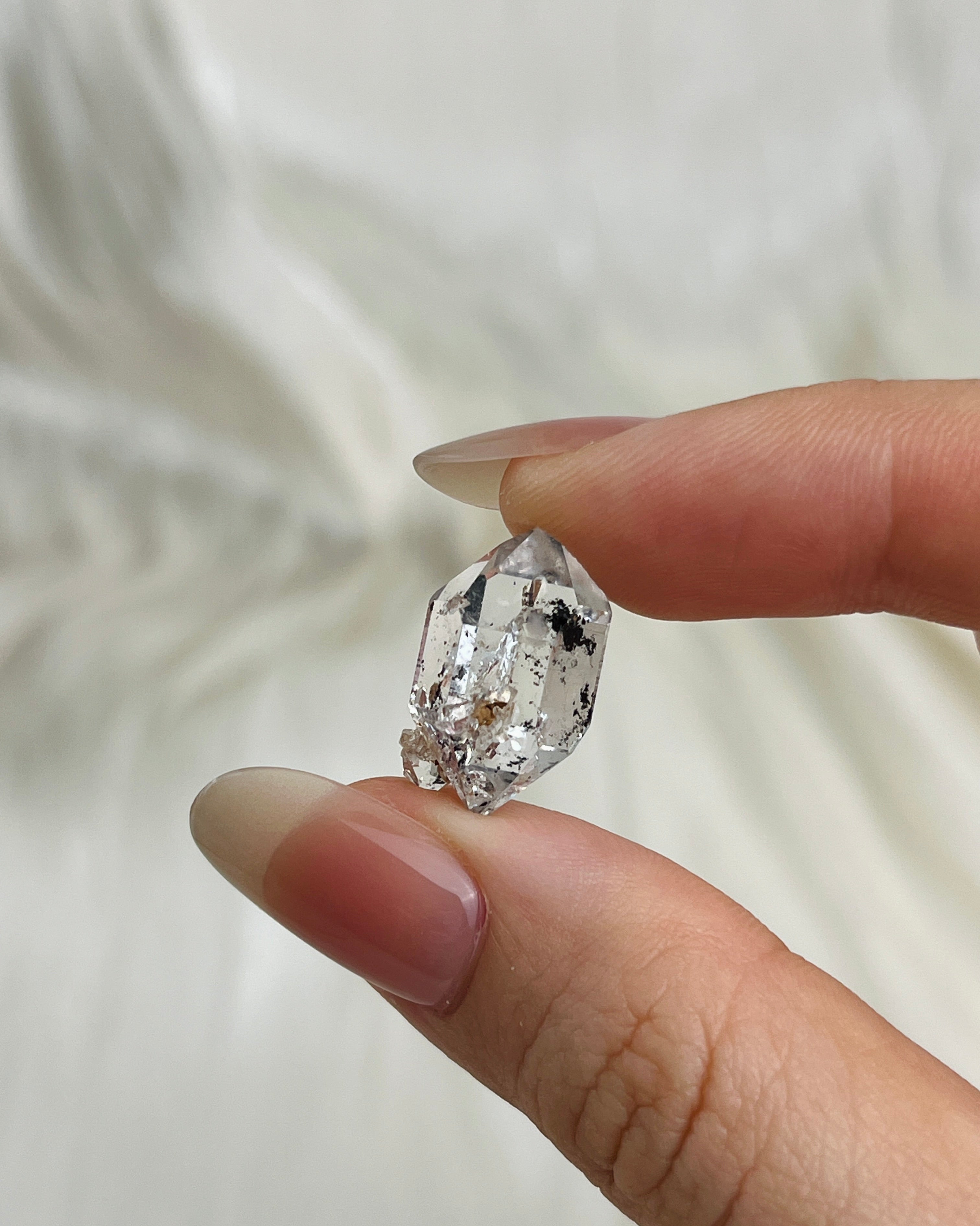 Water-clear Chongqing Diamond Quartz with rainbow reflections, calcite inclusion, and natural pit marks from China2