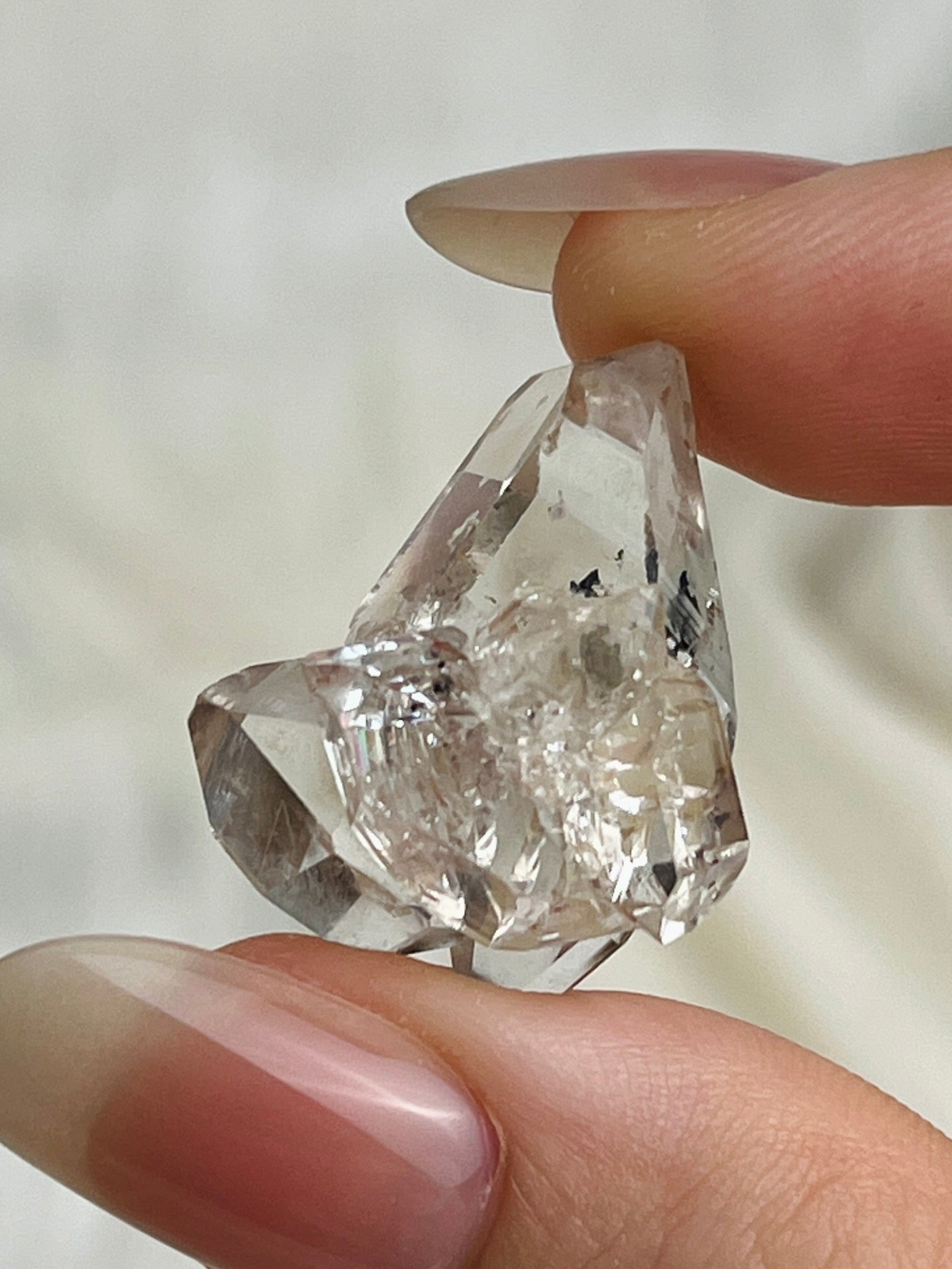 Chongqing Diamond Quartz cluster with inky flower inclusion and partial rider crystal from China
