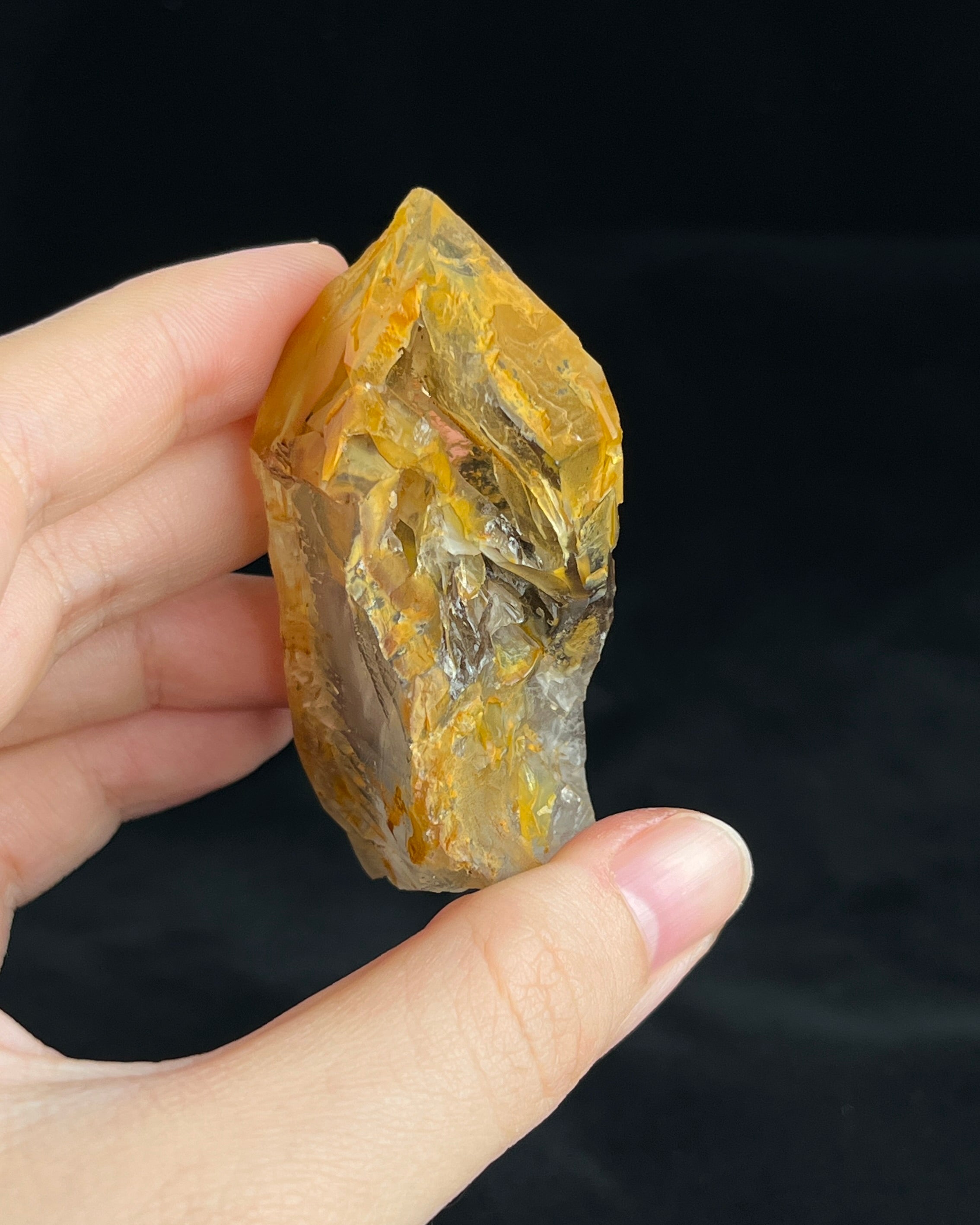 Golden-brown elestial quartz with high clarity, natural etched cavity, and cloud-like surface etching.2