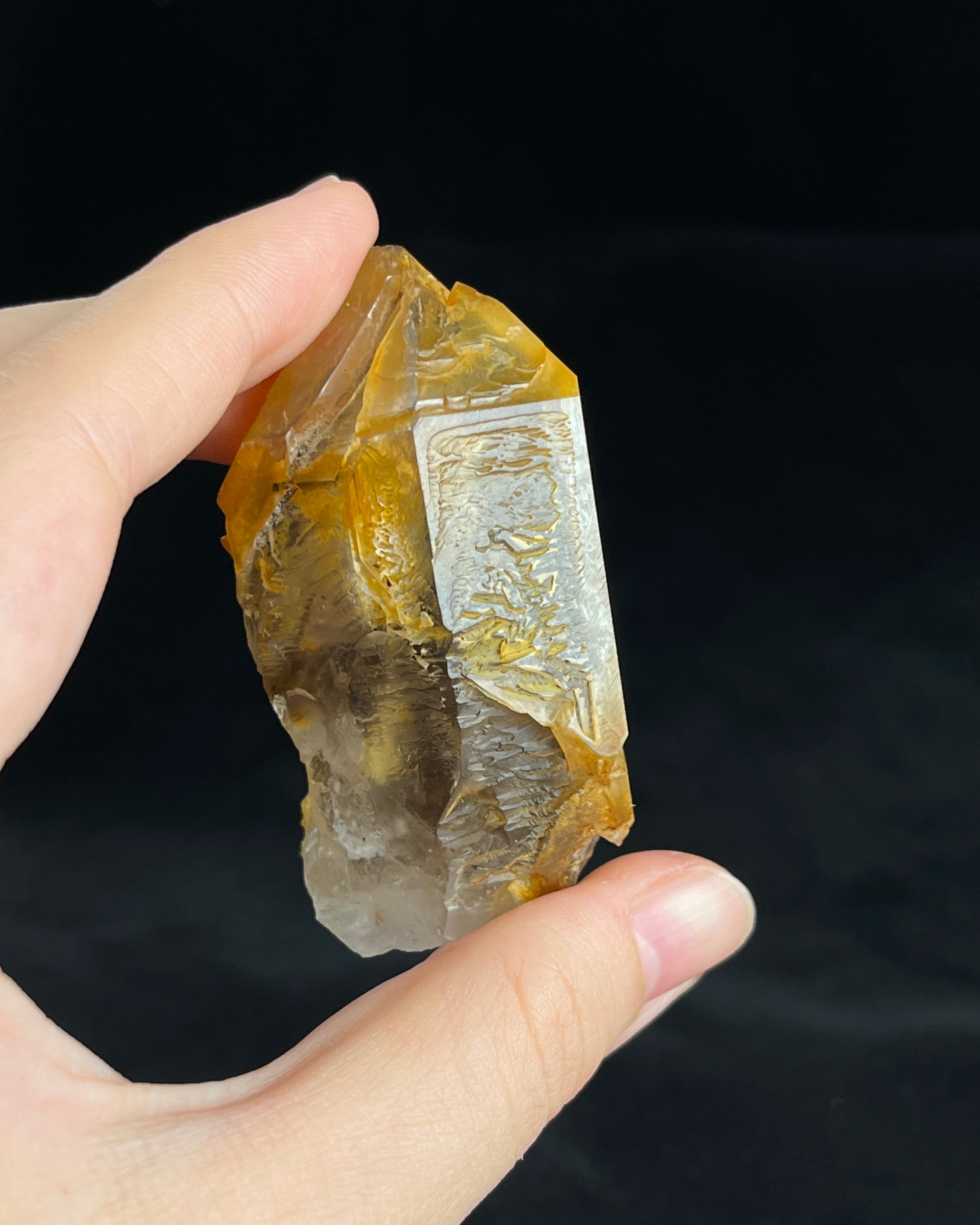 Golden-brown elestial quartz with high clarity, natural etched cavity, and cloud-like surface etching.5