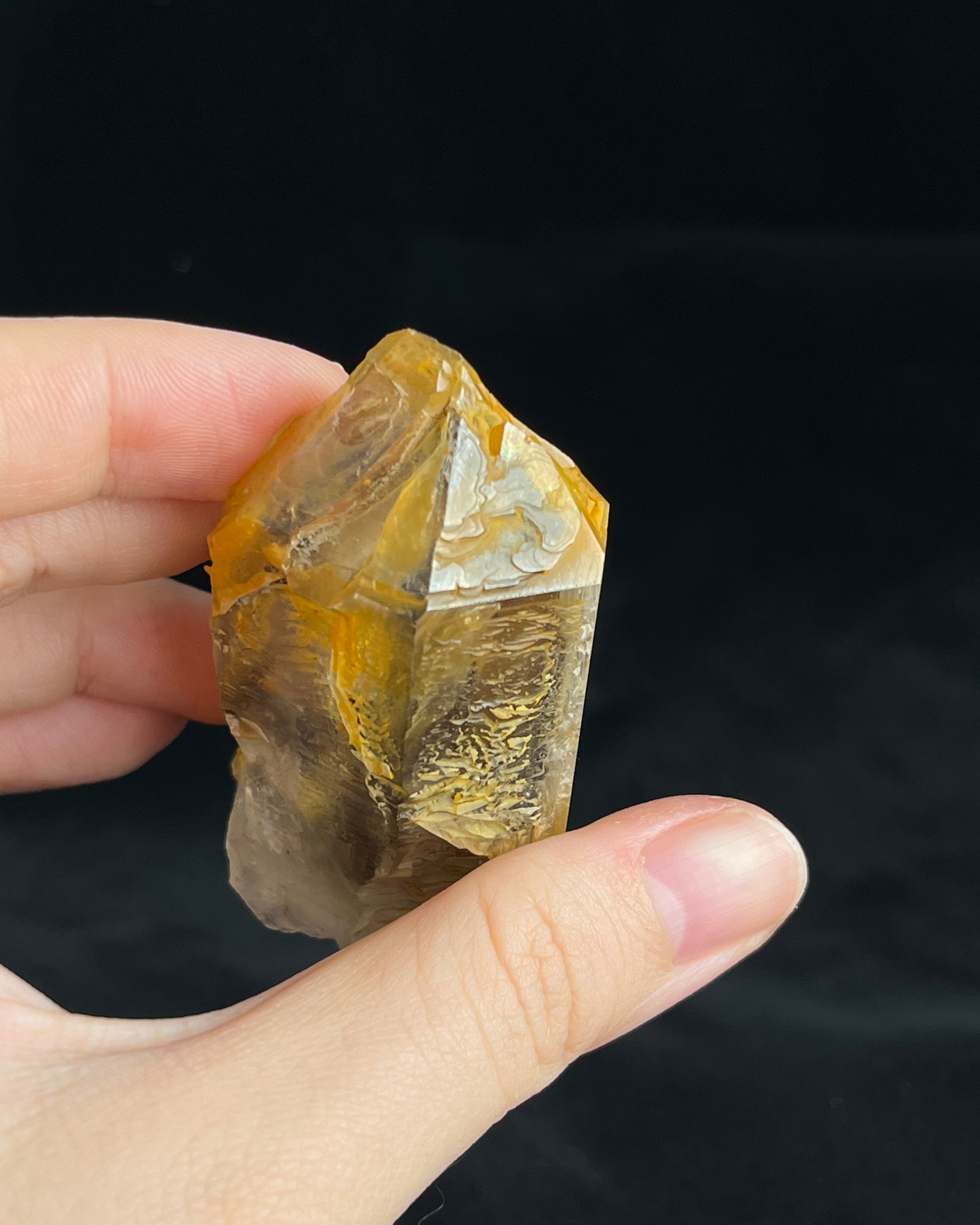 Golden-brown elestial quartz with high clarity, natural etched cavity, and cloud-like surface etching.6