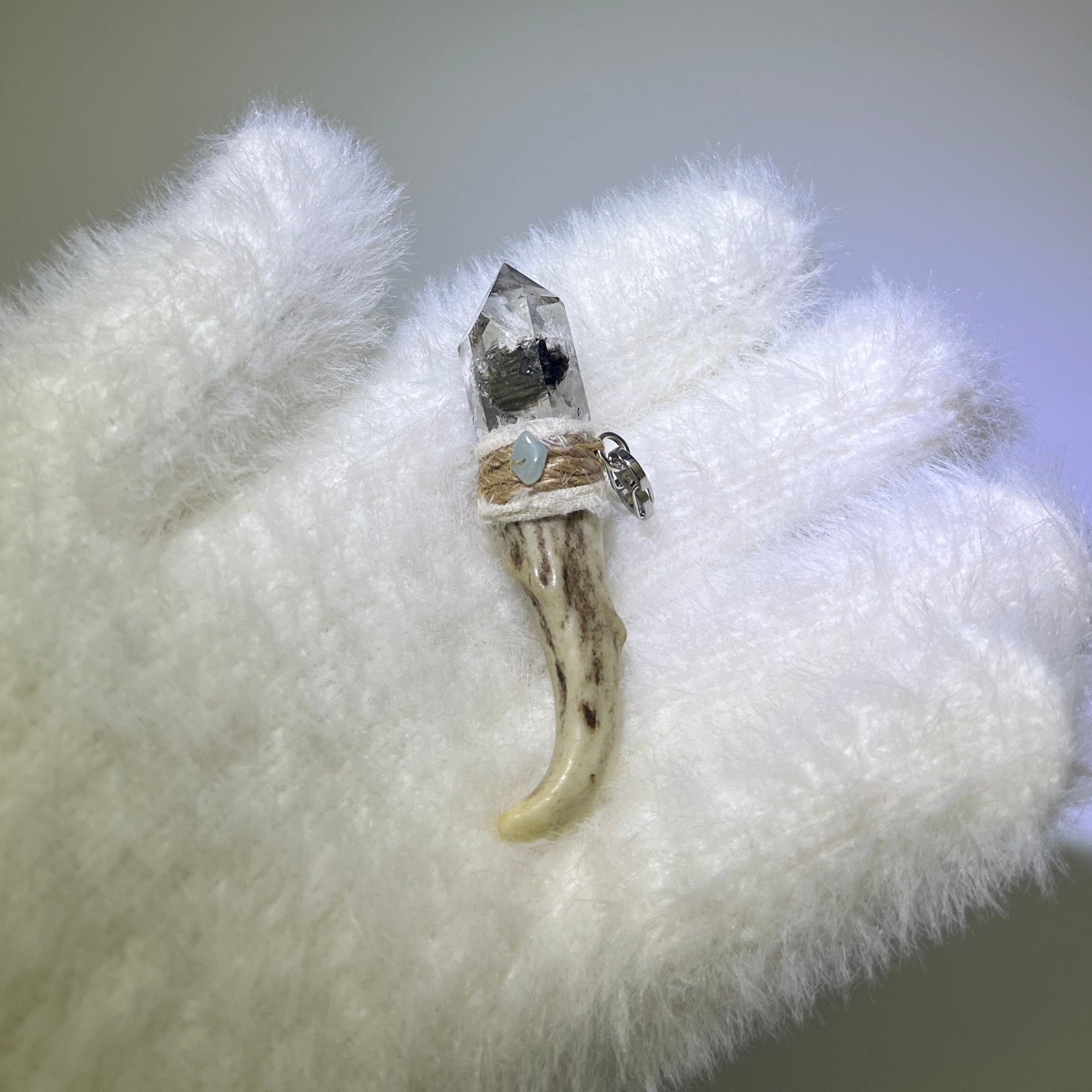 Handcrafted antler pendant with honeycore ink phantom quartz and amazonite accents, wrapped in ivory thread