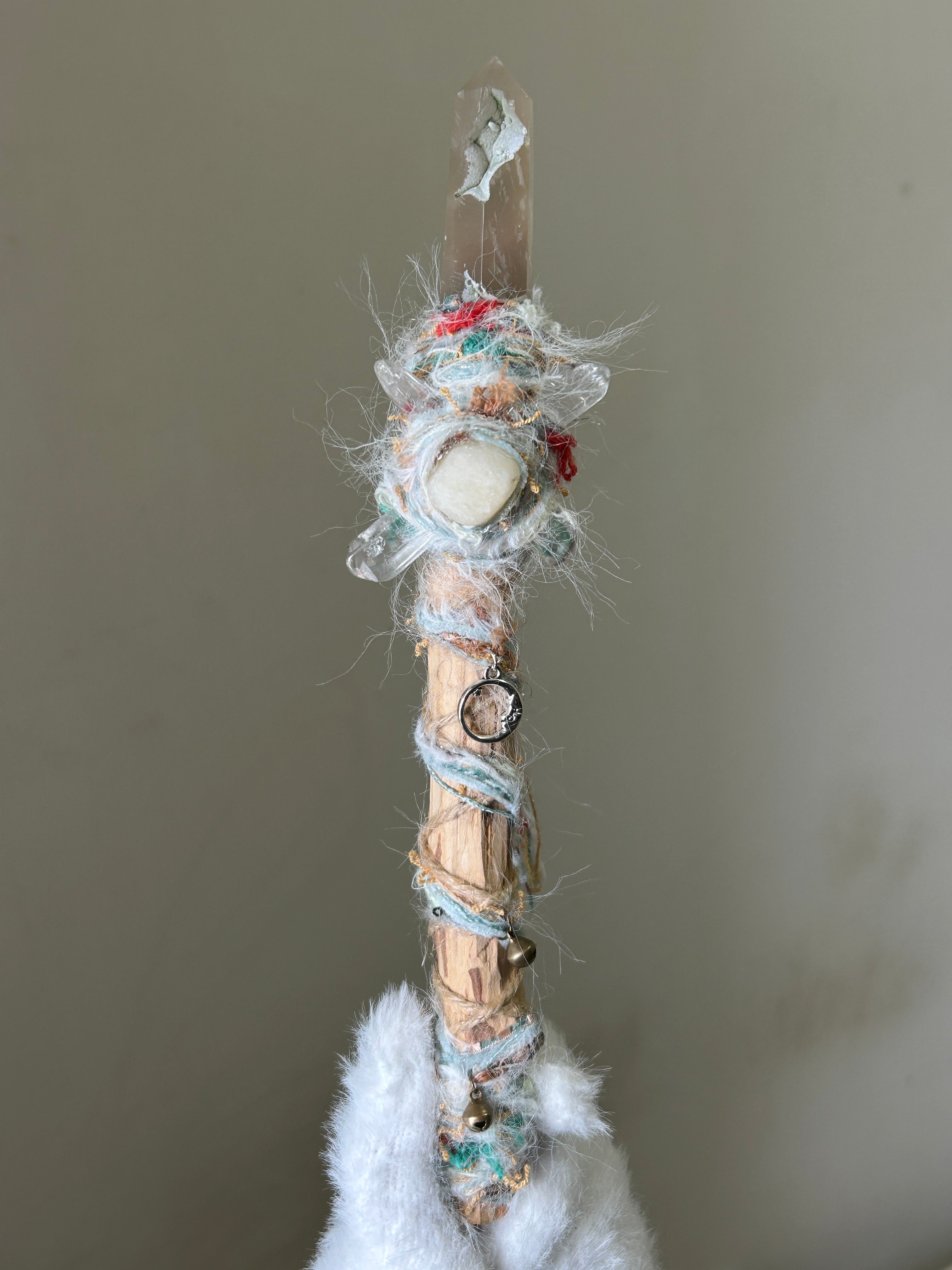 Front view of birch wand with sakura agate tip and pastel thread wrap
