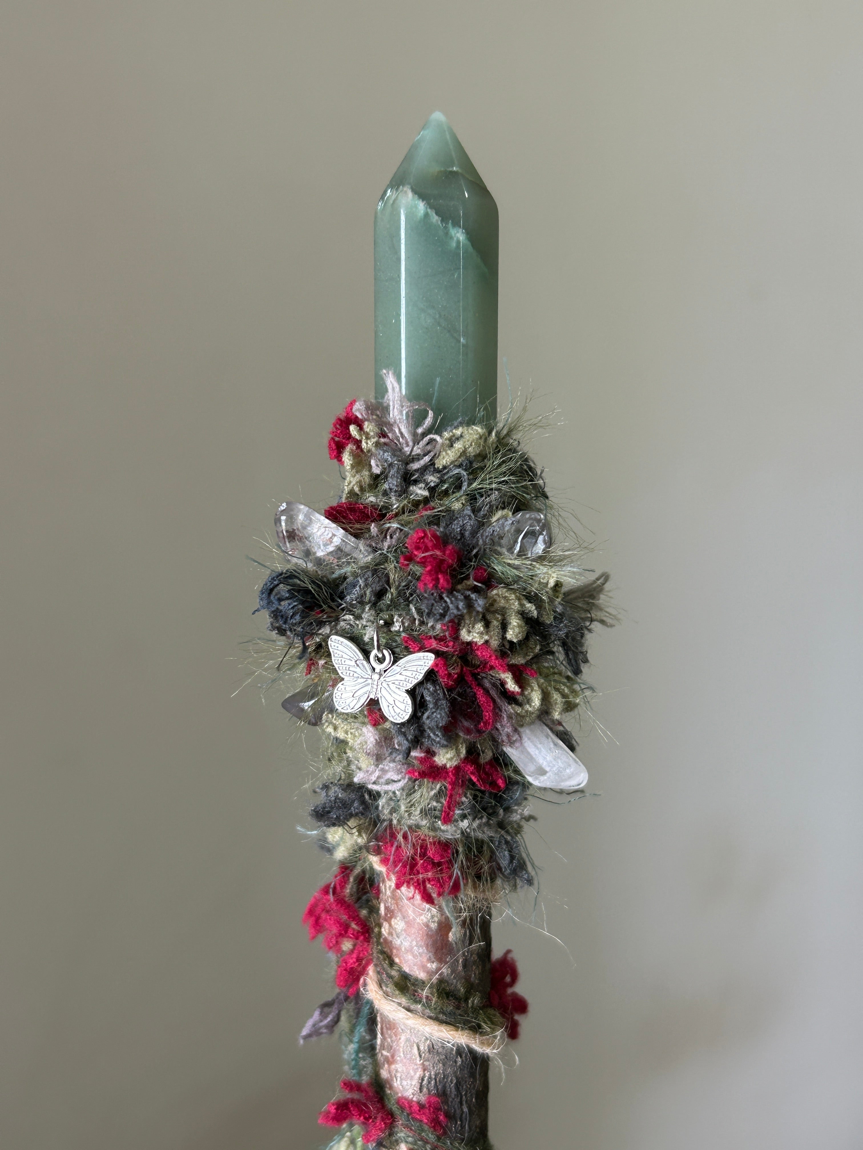 Close-up of aventurine point and floral red fiber accents