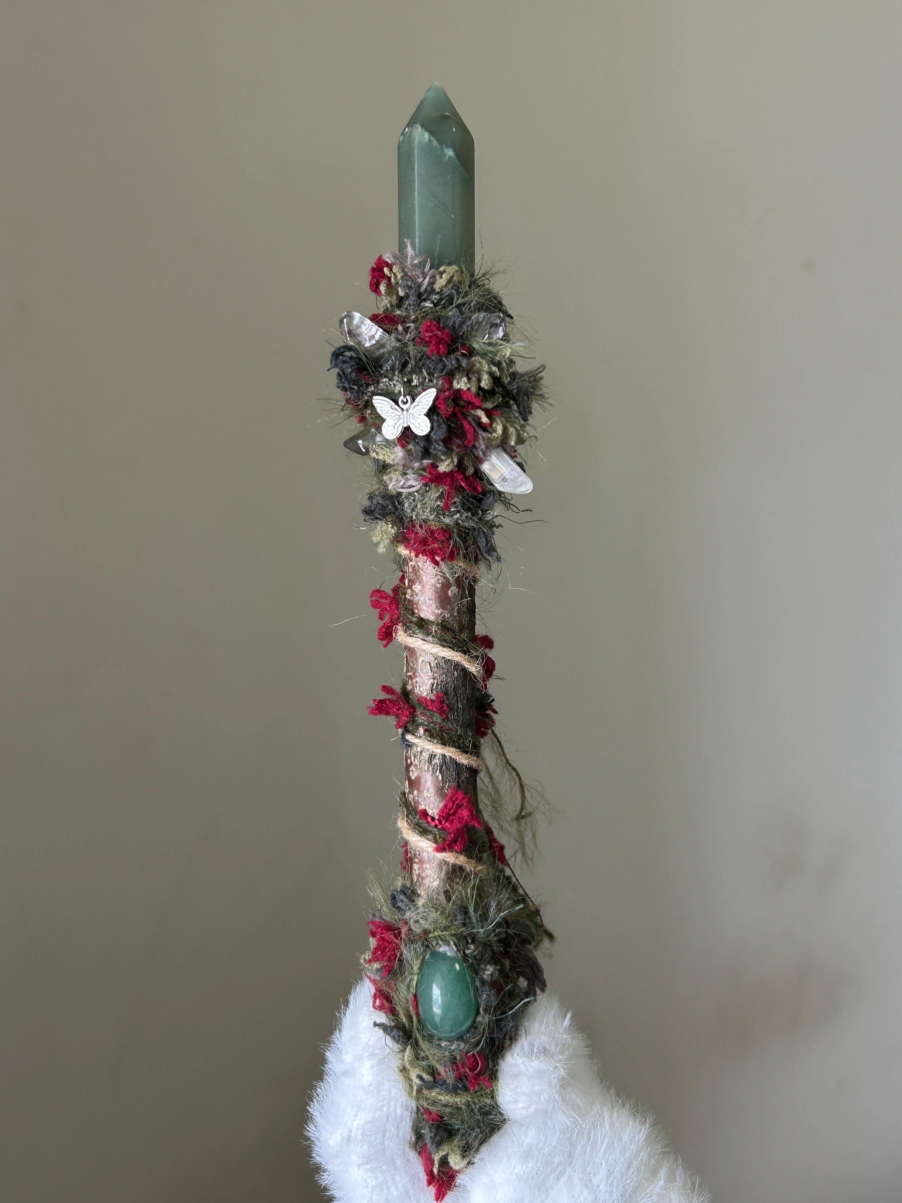 Front view of willow wand with green aventurine point and moss wrap