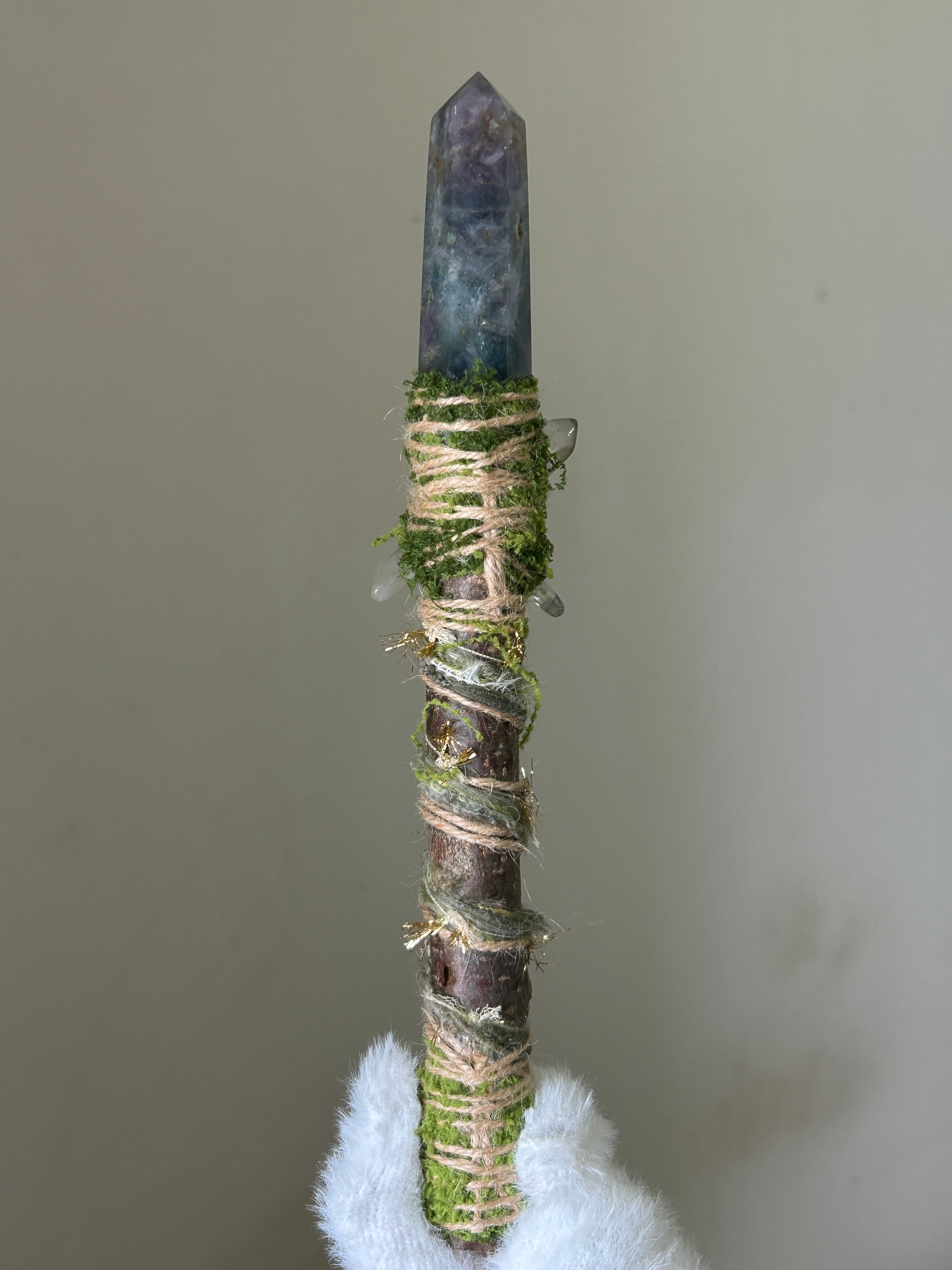 Back view of willow wand with natural twine and butterfly charm