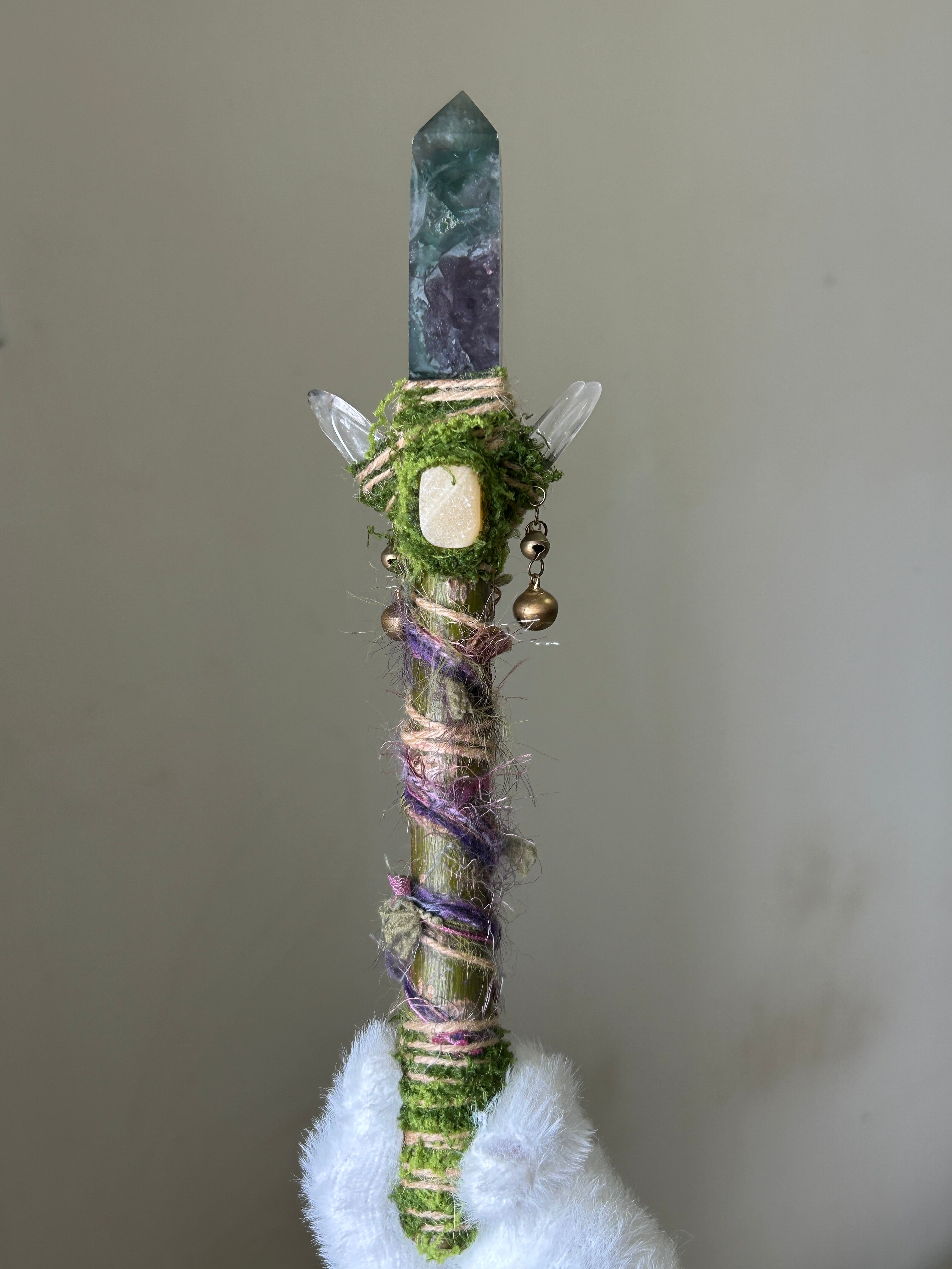 Front view of willow wand with green fluorite and yellow calcite