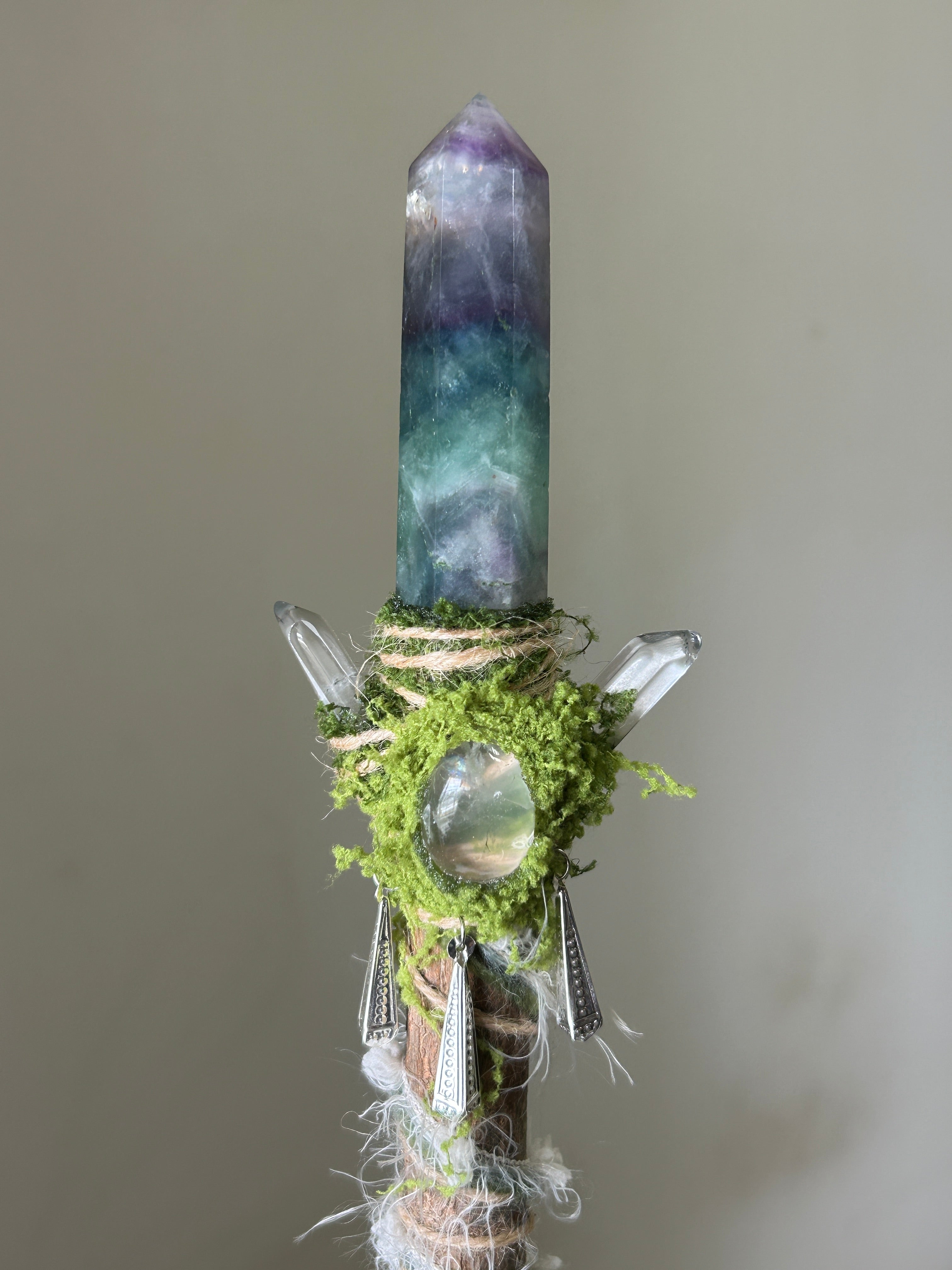 Close-up of fluorite point with moss wrap and silver details