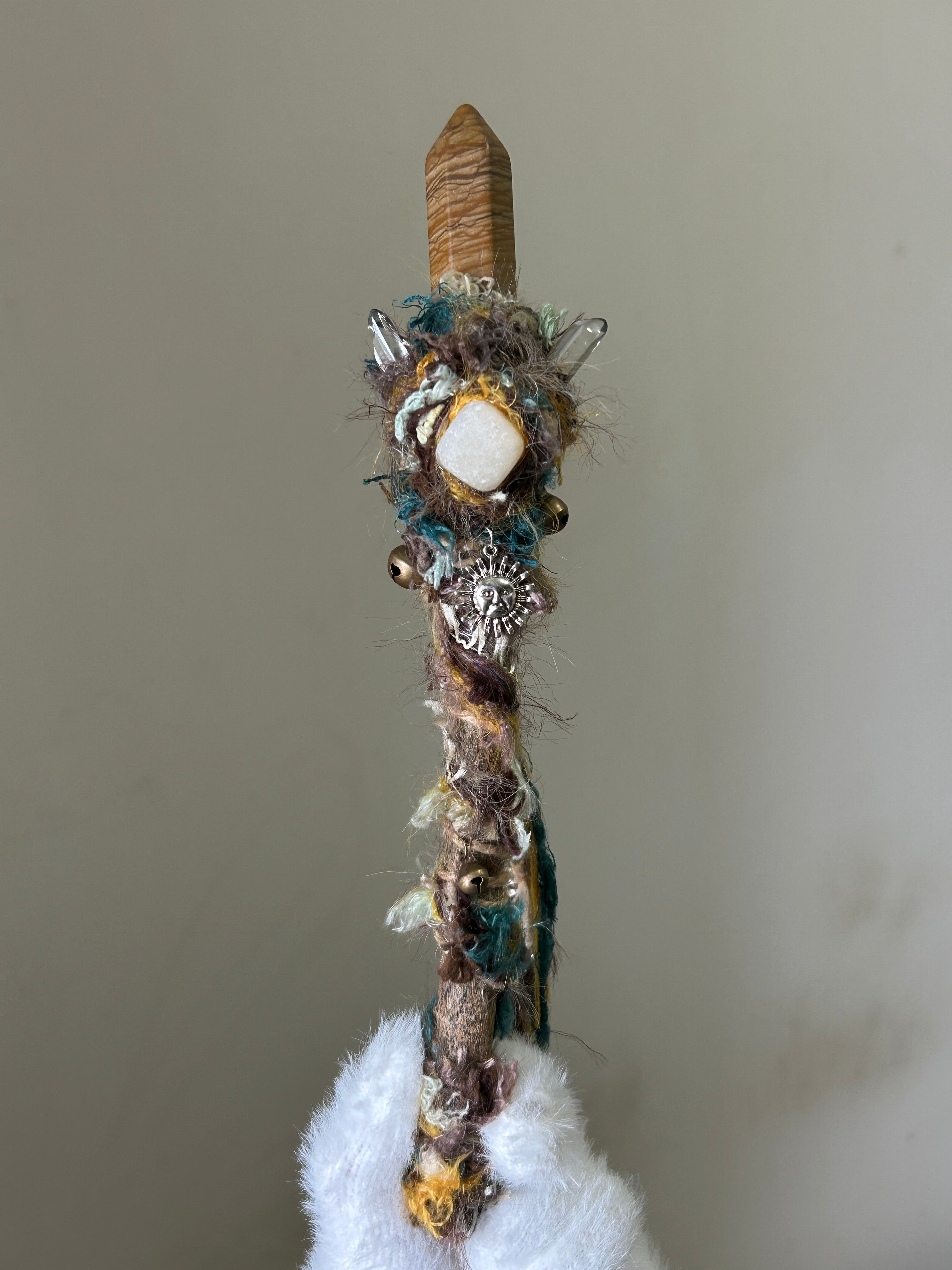 Front view of willow wand with picture jasper point and yellow calcite accent