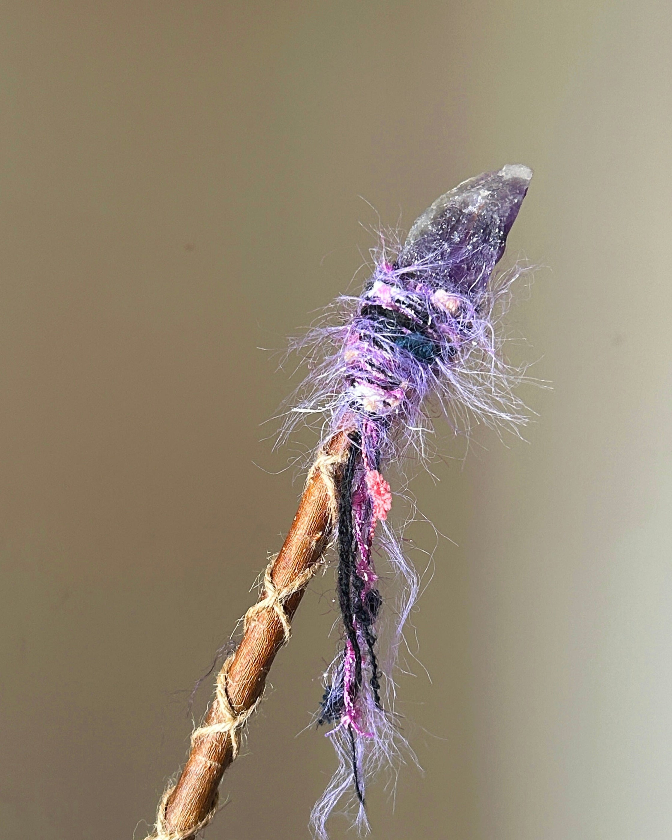 Back view of amethyst wand with spiral threads and dreamy textured yarn
