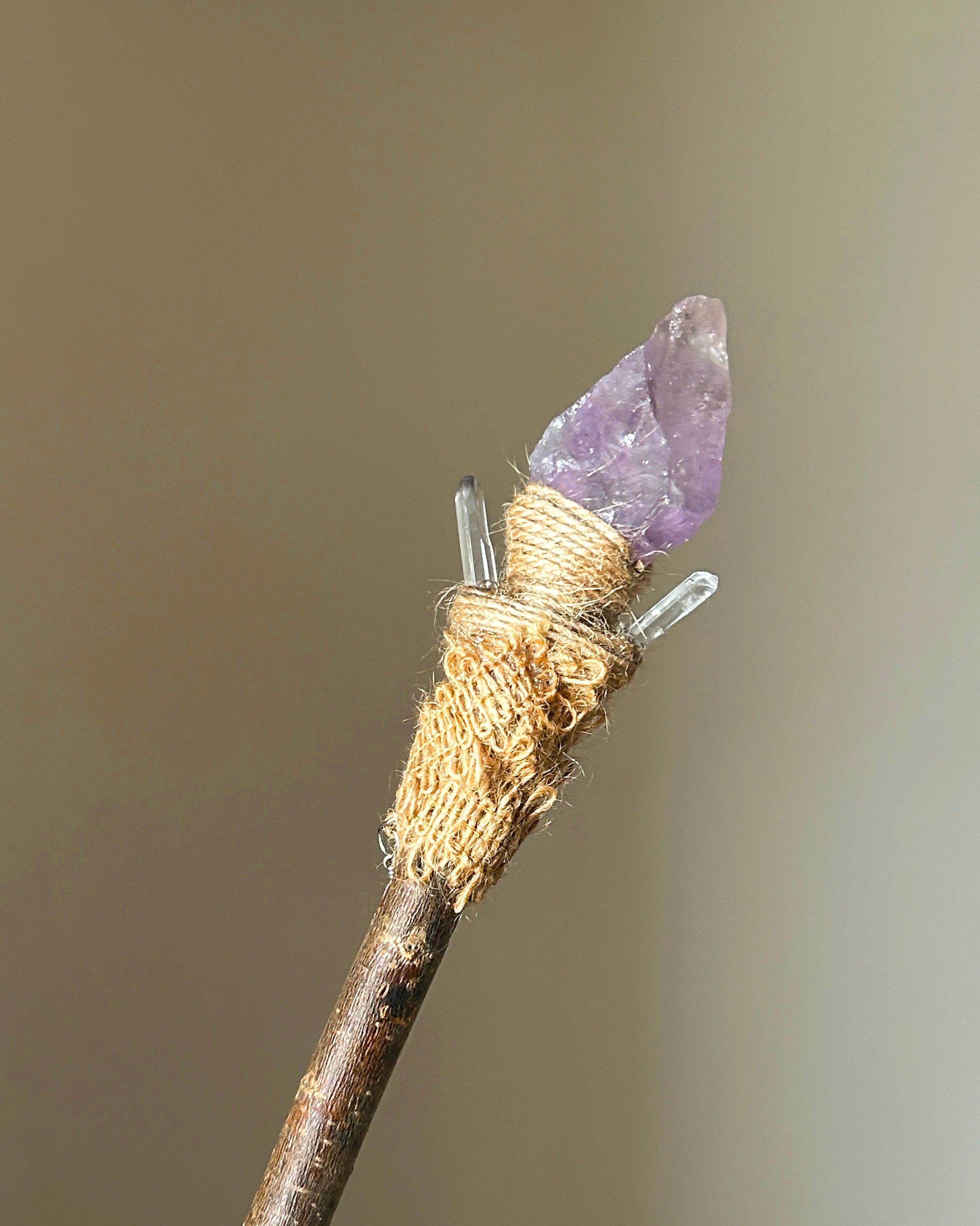 Back view of spiritual forest wand with quartz tips and jute fiber wrapping