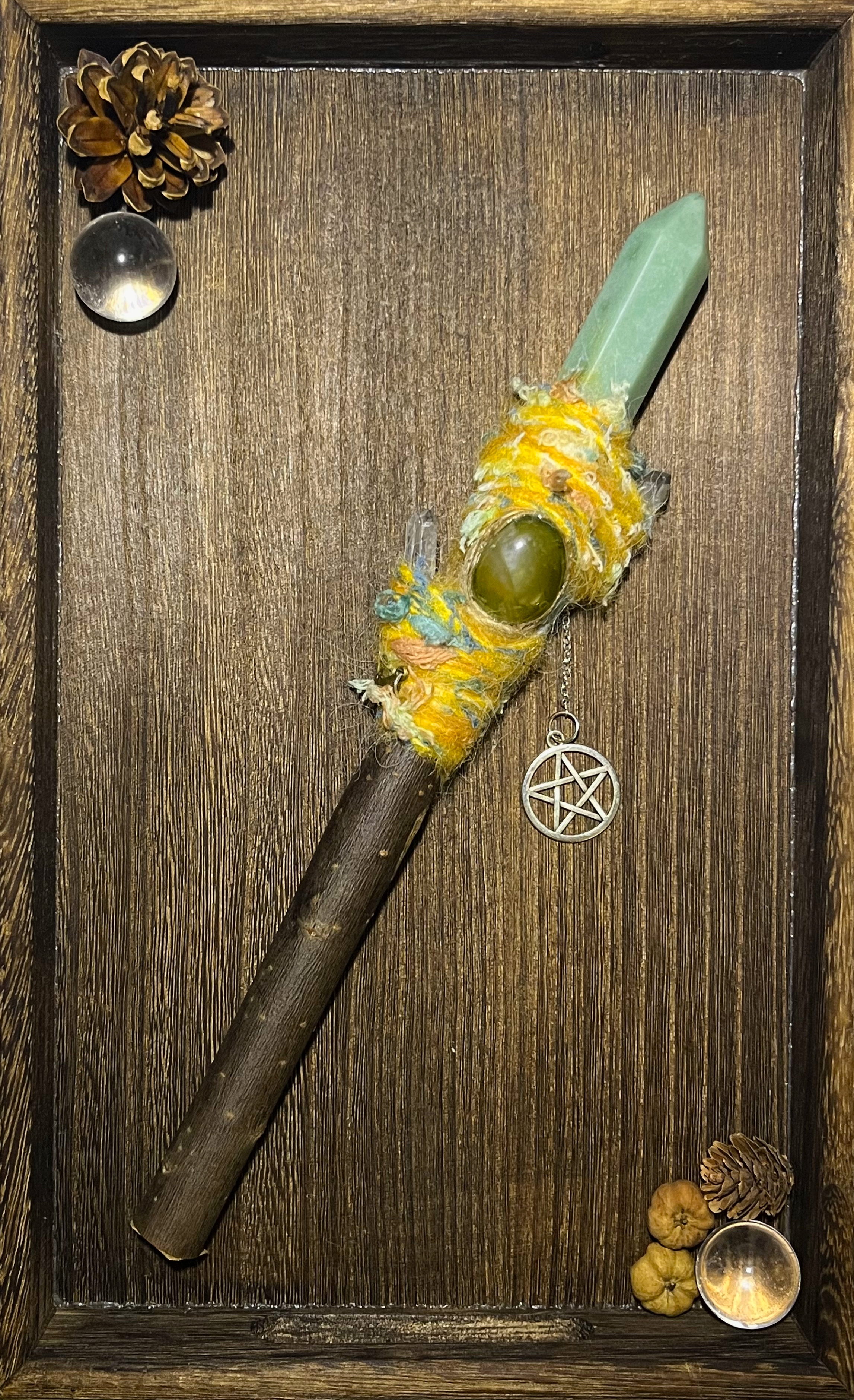 Flat lay of sunny ritual wand with heart chakra focus and joyful fiber textures
