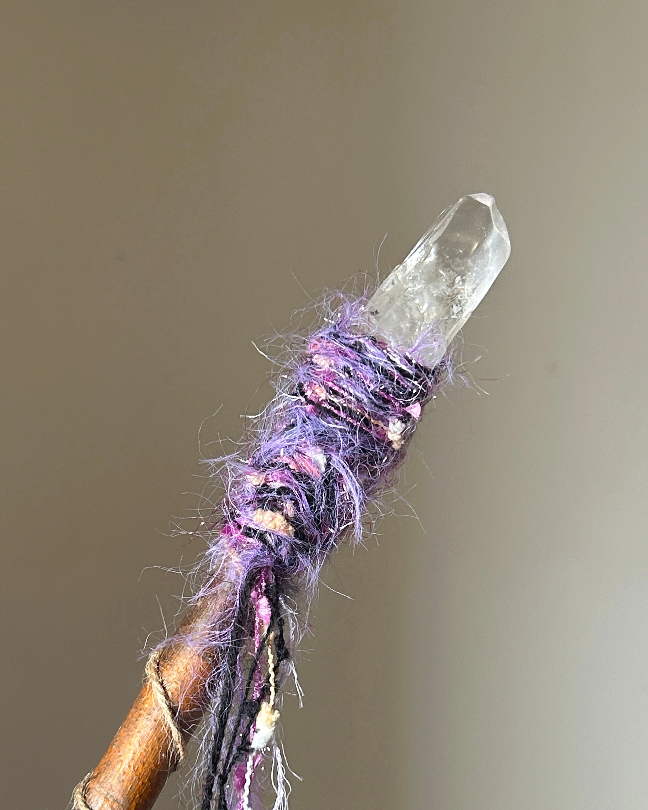 Back view of spiritual wand showing yellow jasper centerpiece and fiber spirals