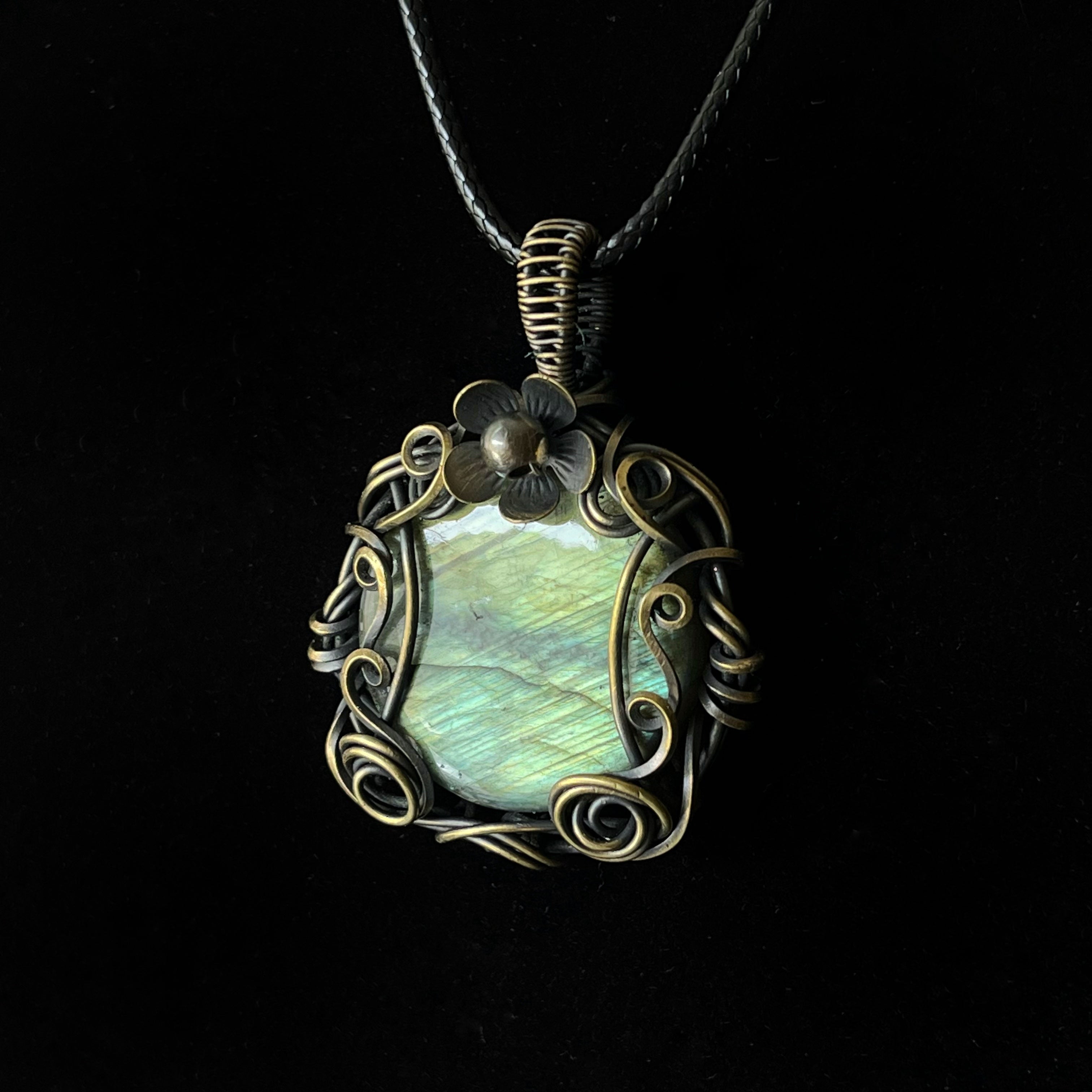 Antiqued brass labradorite pendant with floral top and decorative scroll wirework