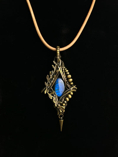 Blue-flash labradorite pendant with antiqued brass branch and leaf wirework