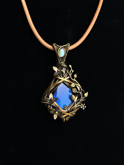 Blue-flash labradorite pendant with antiqued brass floral vine wirework