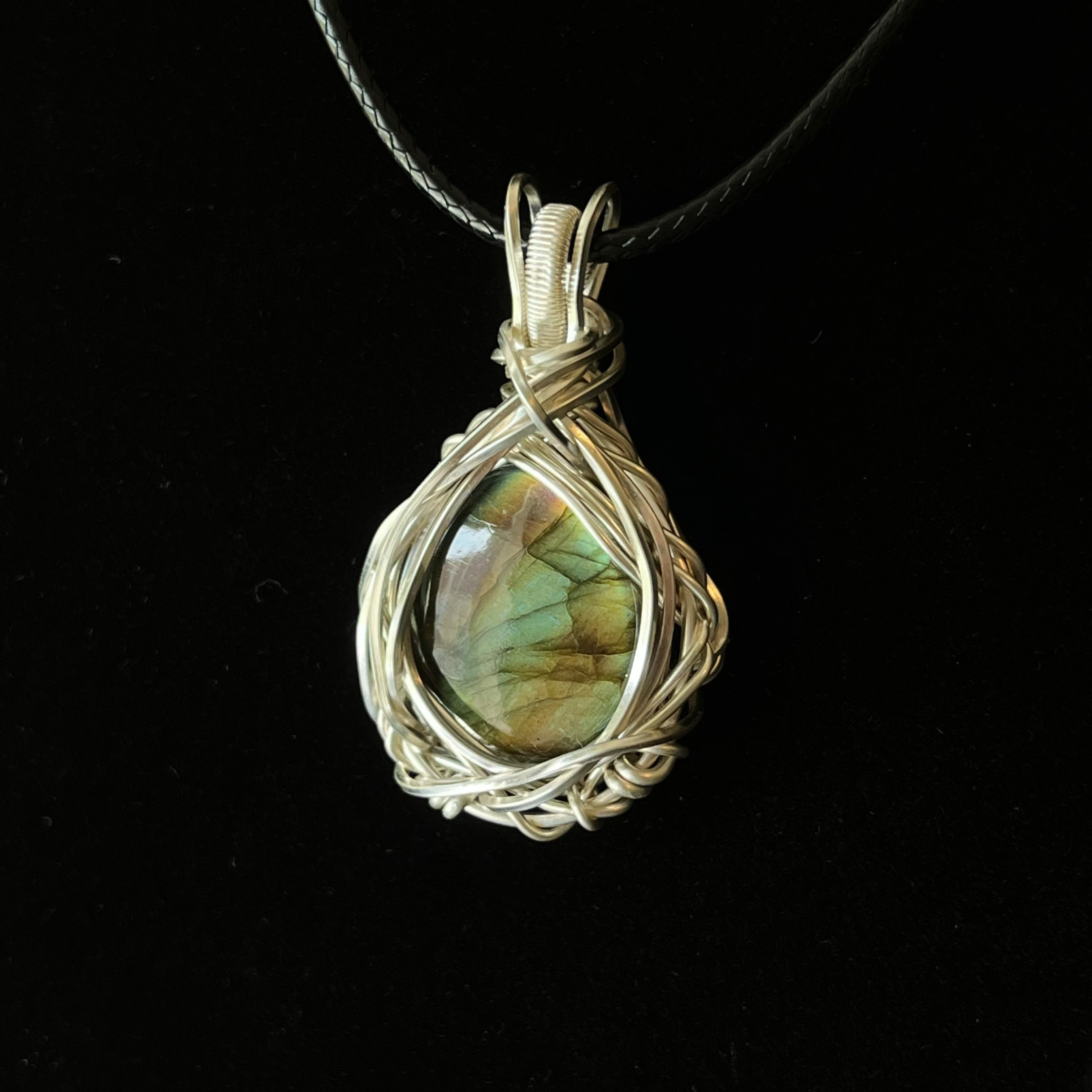 Silver wire-wrapped teardrop labradorite pendant with woven nest design