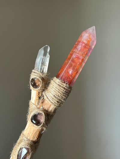 Close-up of crystal tip and embedded smoky quartz stones with raw jute wrapping