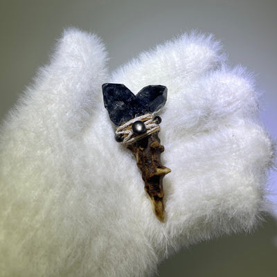 Black Warrior Twin-Crystal antler wand wrapped with beige thread and silver obsidian bead, displayed on a white glove