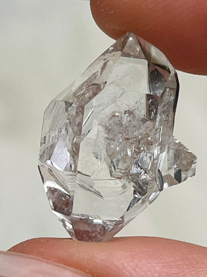 Bright Chongqing Diamond Quartz crystal with a flower-shaped surface mark and a light grey tip from China