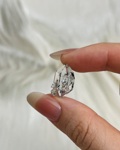 Water-clear Chongqing Diamond Quartz with rainbow reflections, calcite inclusion, and natural pit marks from China1