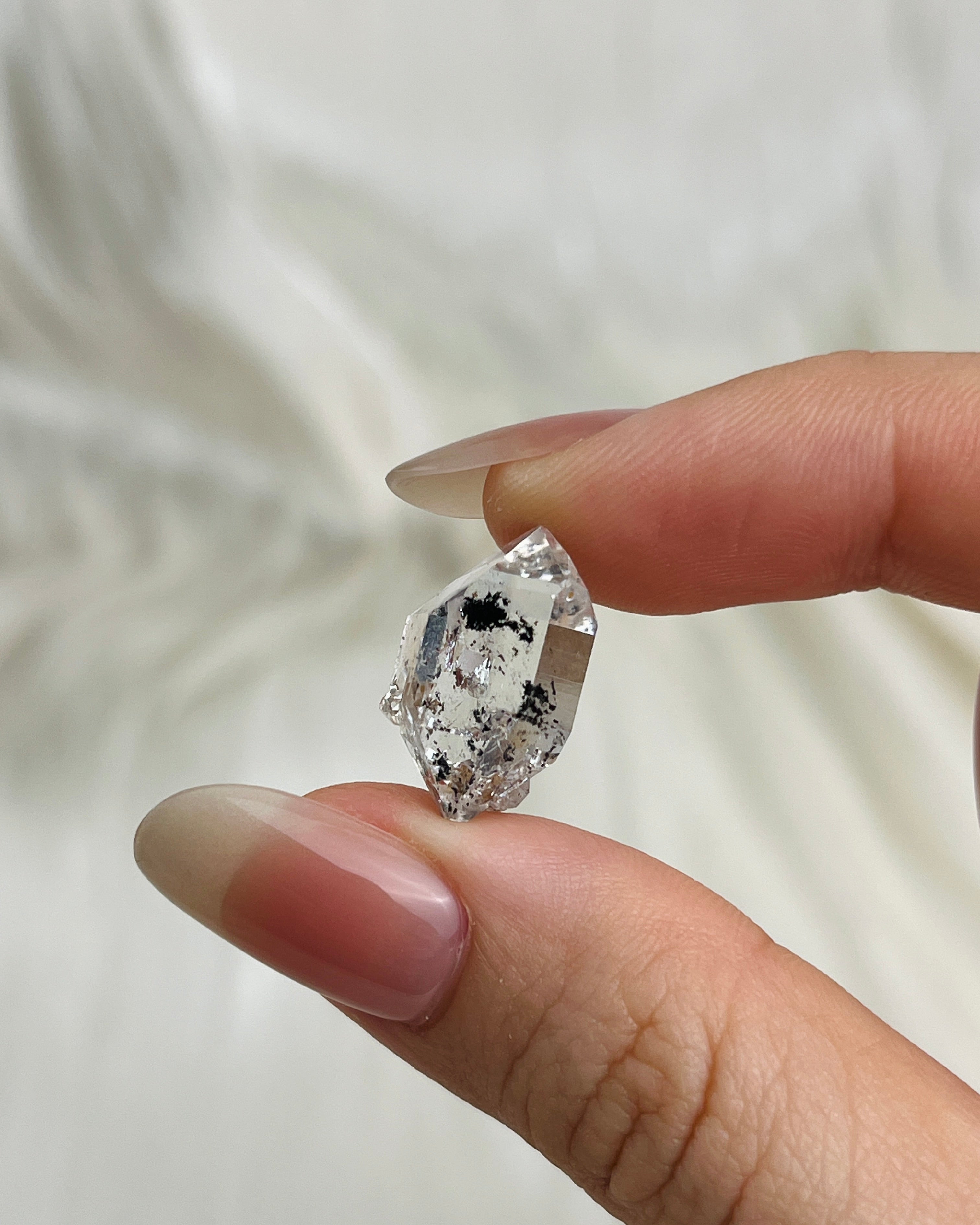 Water-clear Chongqing Diamond Quartz with rainbow reflections, calcite inclusion, and natural pit marks from China3