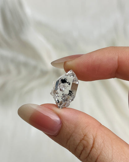 Water-clear Chongqing Diamond Quartz with rainbow reflections, calcite inclusion, and natural pit marks from China3