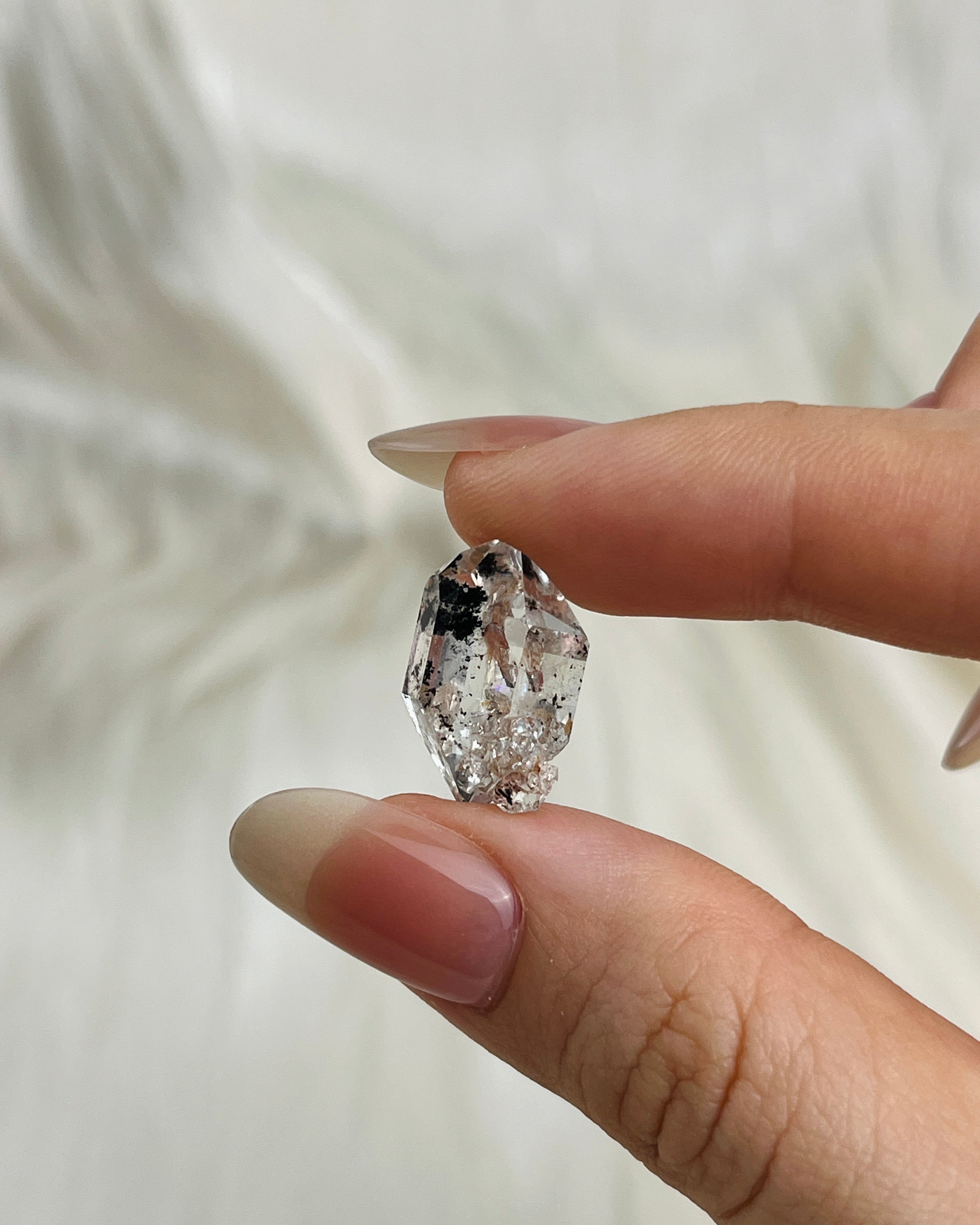 Water-clear Chongqing Diamond Quartz with rainbow reflections, calcite inclusion, and natural pit marks from China5