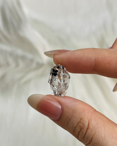 Water-clear Chongqing Diamond Quartz with rainbow reflections, calcite inclusion, and natural pit marks from China5