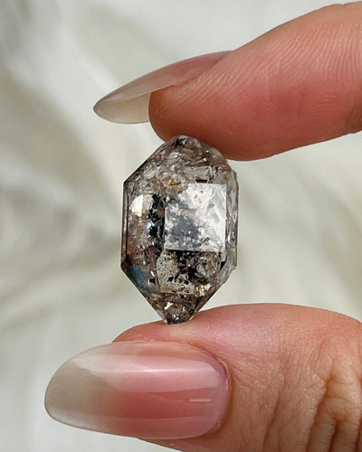 Transparent Chongqing Diamond Quartz cluster with calcite inclusion and internal rainbow reflections from China