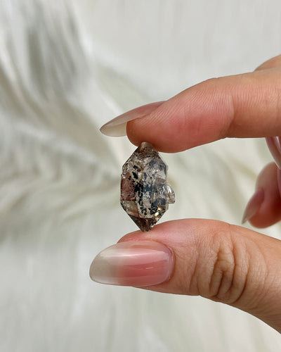 Transparent Chongqing Diamond Quartz cluster with calcite inclusion and internal rainbow reflections from China1