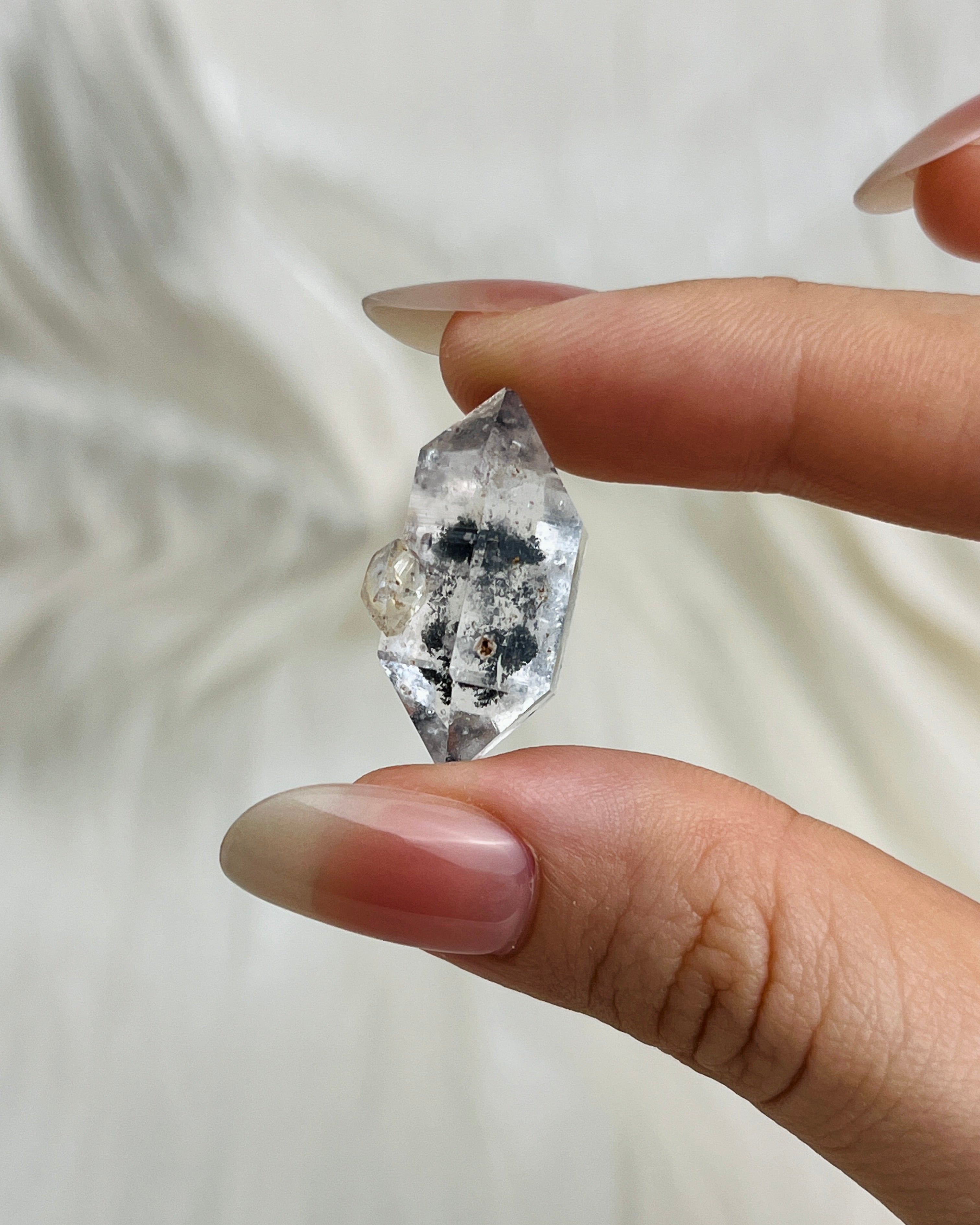 Transparent Chongqing Diamond Quartz with inky phantom inclusion aligned to outer edges and small rider crystal from China2