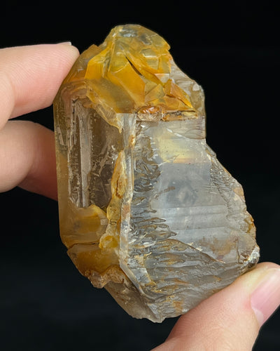 Golden-brown elestial quartz with high clarity, natural etched cavity, and cloud-like surface etching.