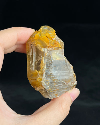 Golden-brown elestial quartz with high clarity, natural etched cavity, and cloud-like surface etching.1