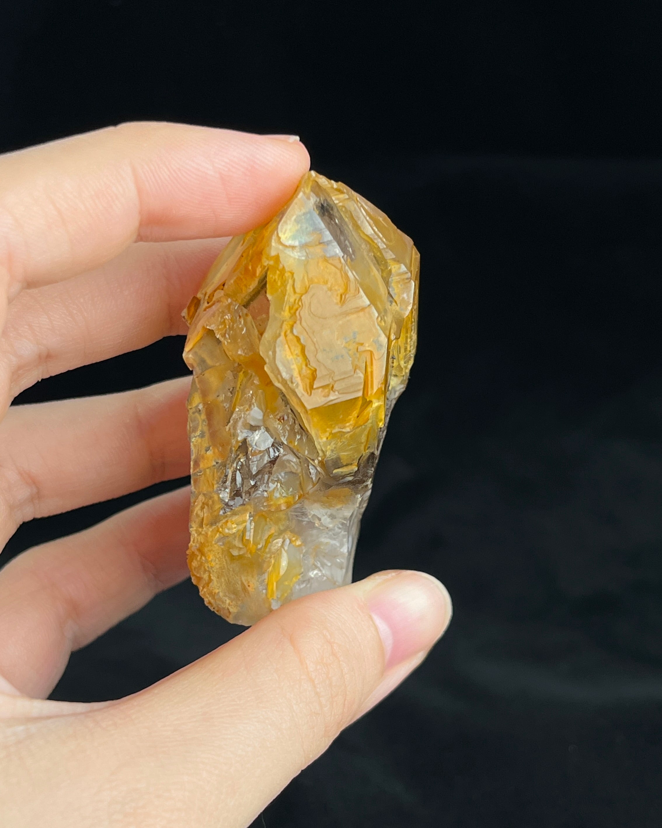 Golden-brown elestial quartz with high clarity, natural etched cavity, and cloud-like surface etching.3