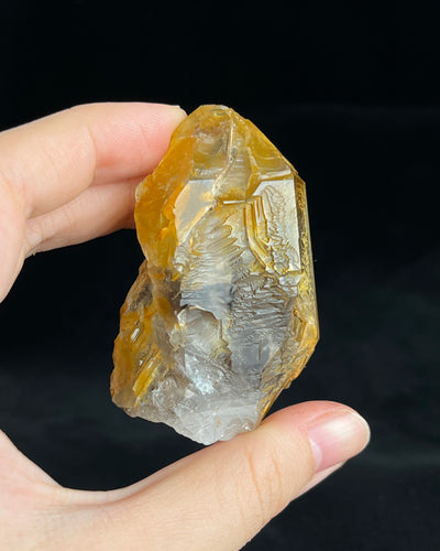 Golden-brown elestial quartz with high clarity, natural etched cavity, and cloud-like surface etching.4