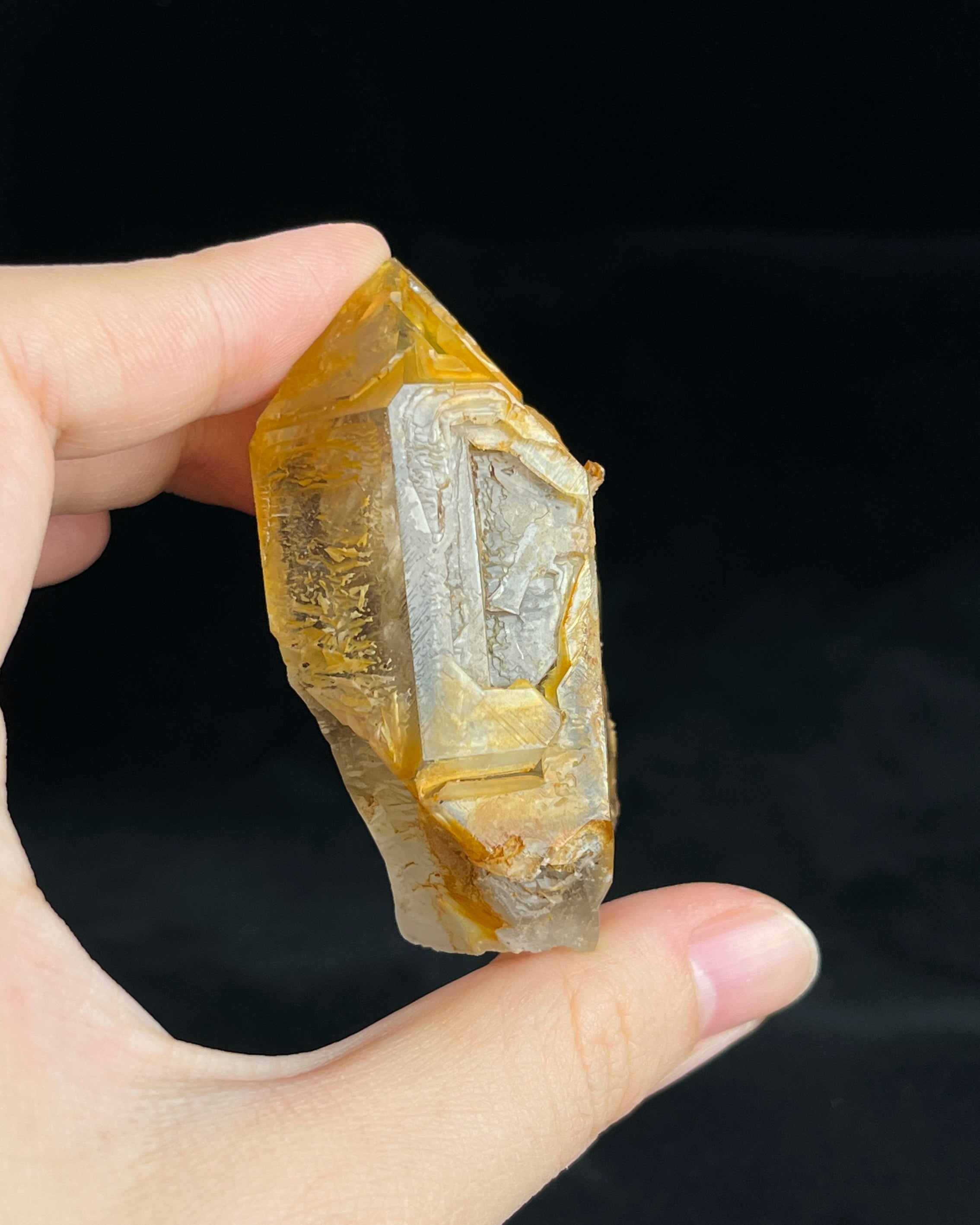 Golden-brown elestial quartz with high clarity, natural etched cavity, and cloud-like surface etching.7