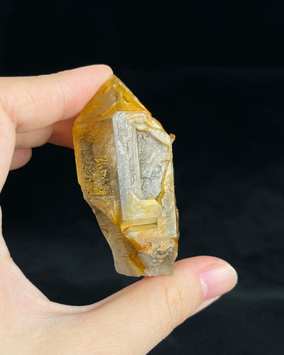 Golden-brown elestial quartz with high clarity, natural etched cavity, and cloud-like surface etching.7