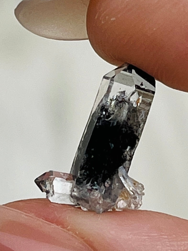 Mini Chongqing Diamond Daw Quartz crystal from China with hidden mountain inclusions and small rider crystals