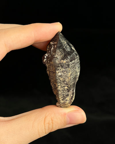 Namibian amethyst with violet core and etched crocodile-textured surface, showing dark micro-inclusions.1