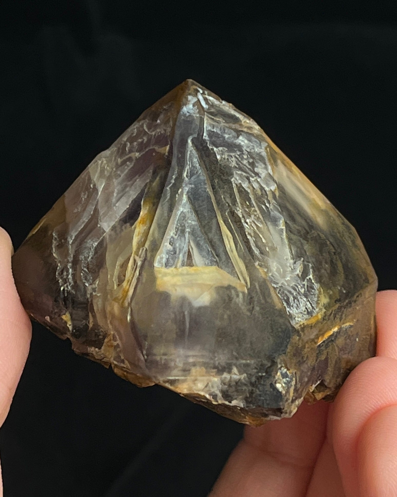 Natural Namibian skeletal amethyst specimen with etched “mountain” formations and smoky-violet zoning.