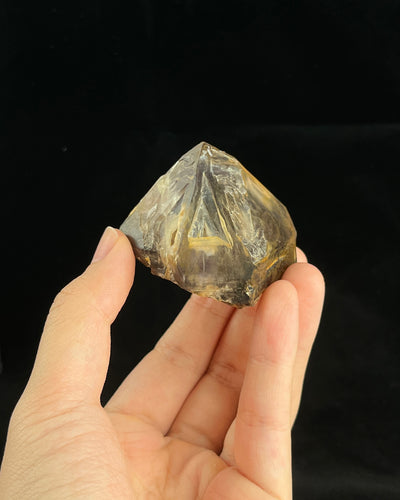 Natural Namibian skeletal amethyst specimen with etched “mountain” formations and smoky-violet zoning.2