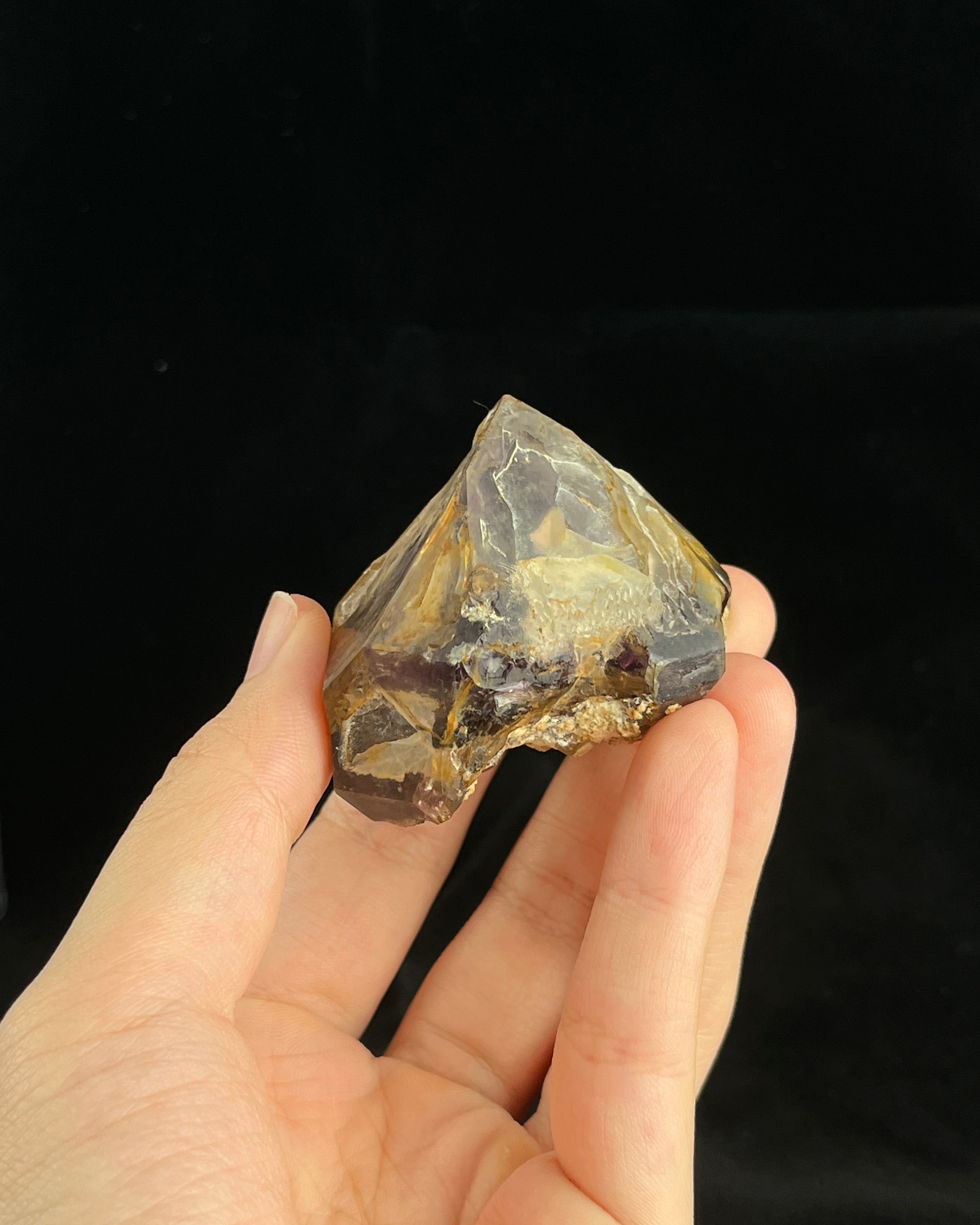 Natural Namibian skeletal amethyst specimen with etched “mountain” formations and smoky-violet zoning.4